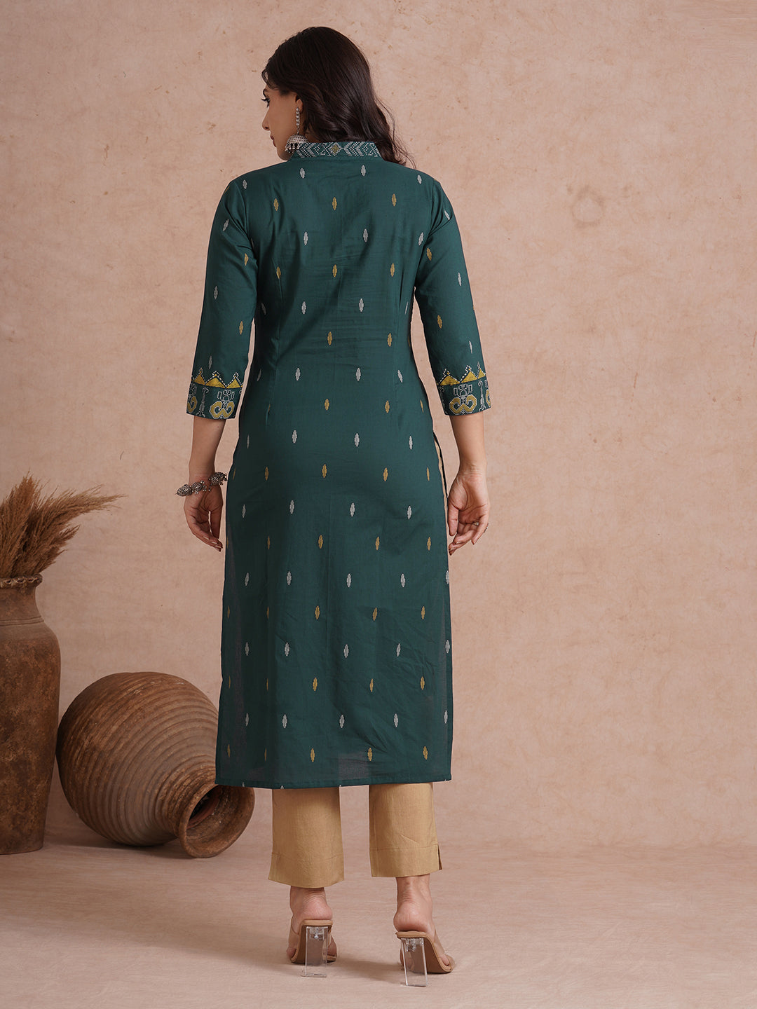 Straight fit cotton printed kurta with block printed neckline and sleeves.