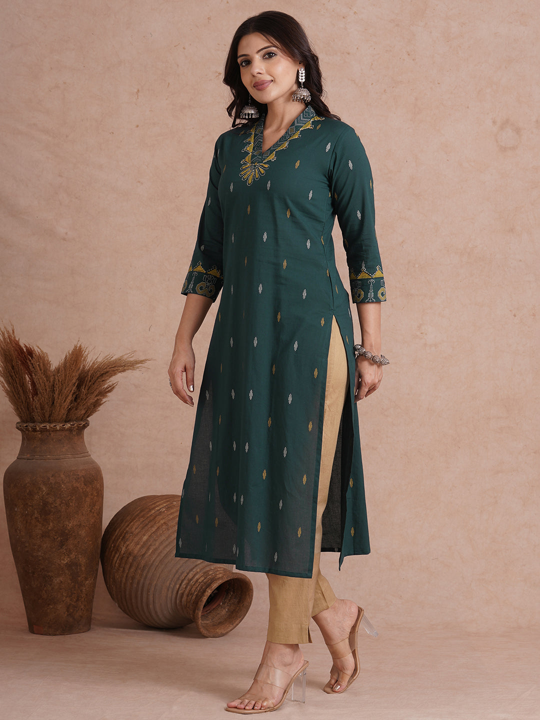 Straight fit cotton printed kurta with block printed neckline and sleeves.