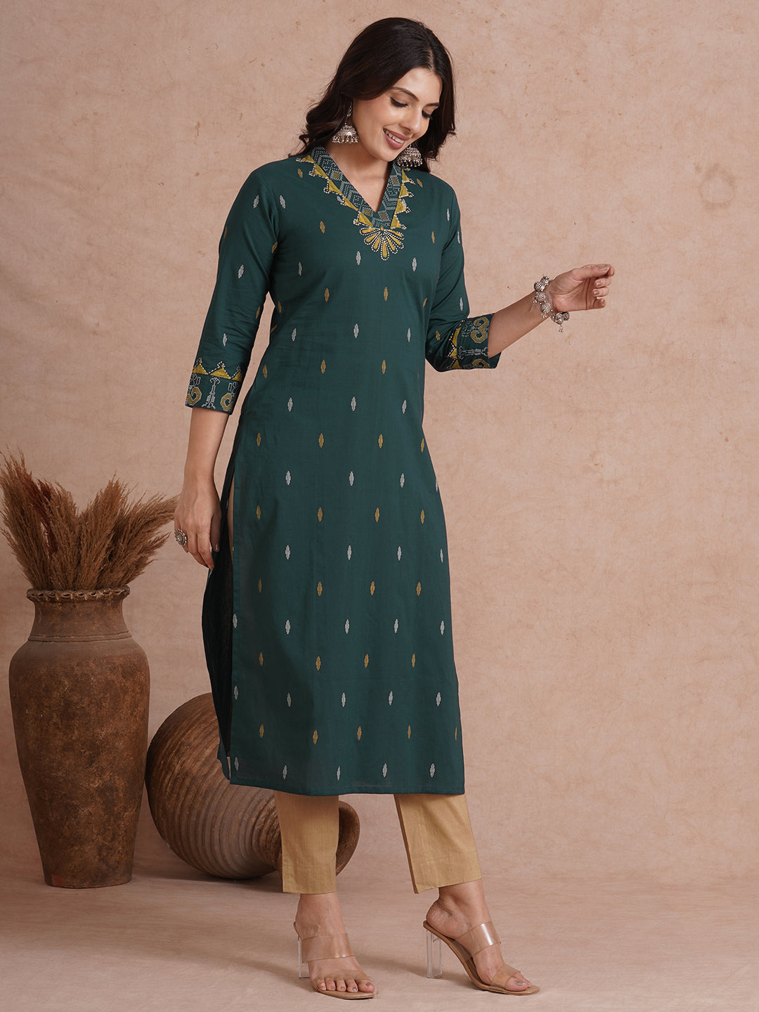 Straight fit cotton printed kurta with block printed neckline and sleeves.