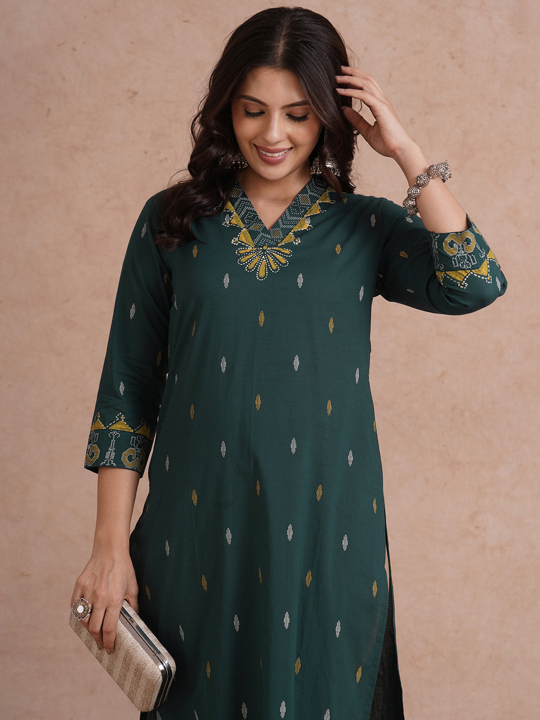 Straight fit cotton printed kurta with block printed neckline and sleeves.