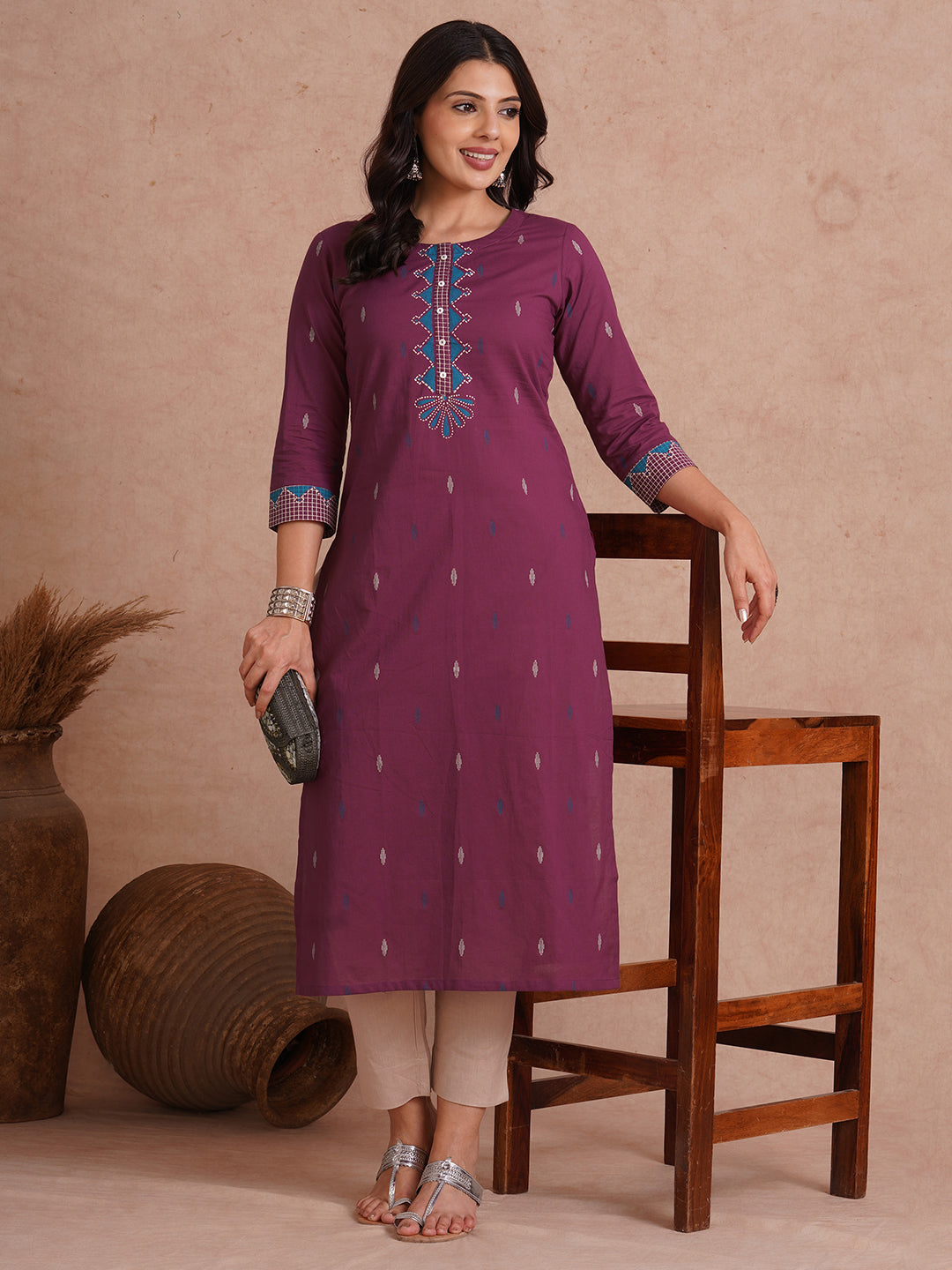 Straight fit printed kurta with trim fabric placket and cuff highlighted with block print.