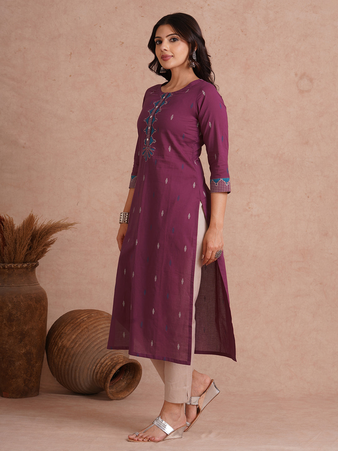 Straight fit printed kurta with trim fabric placket and cuff highlighted with block print.