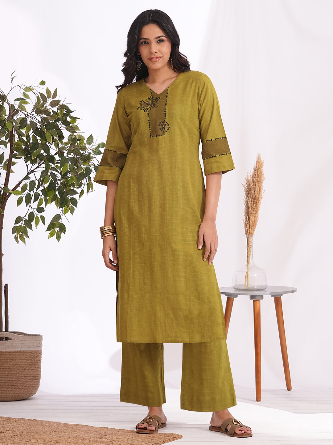 Straight fit woven checks kurta with asymmetrical block print highlighted with buttons and bell sleeves