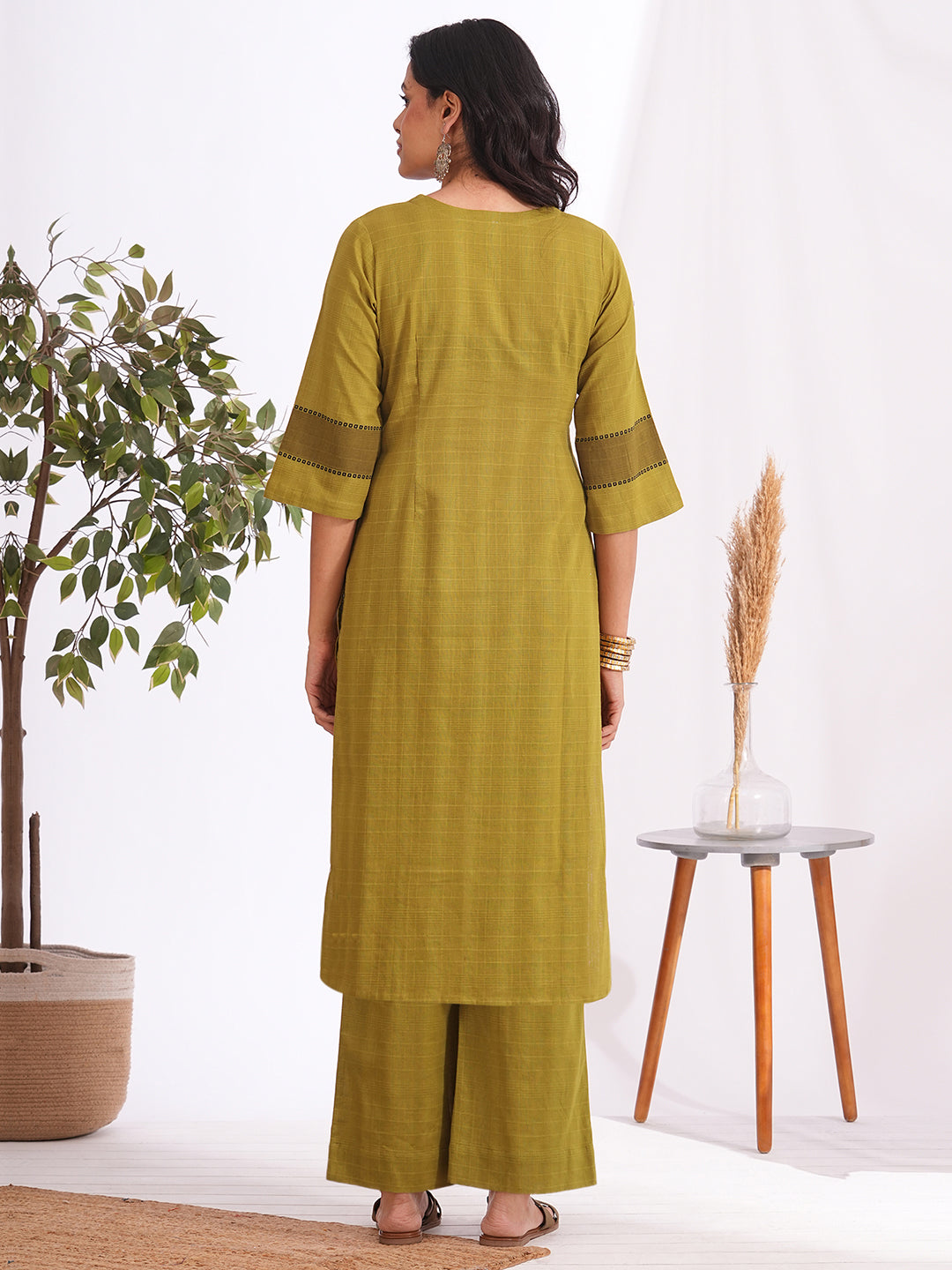 Straight fit woven checks kurta with asymmetrical block print highlighted with buttons and bell sleeves