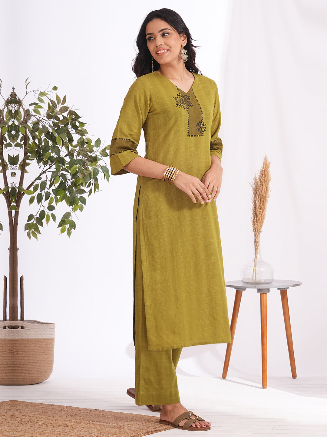 Straight fit woven checks kurta with asymmetrical block print highlighted with buttons and bell sleeves