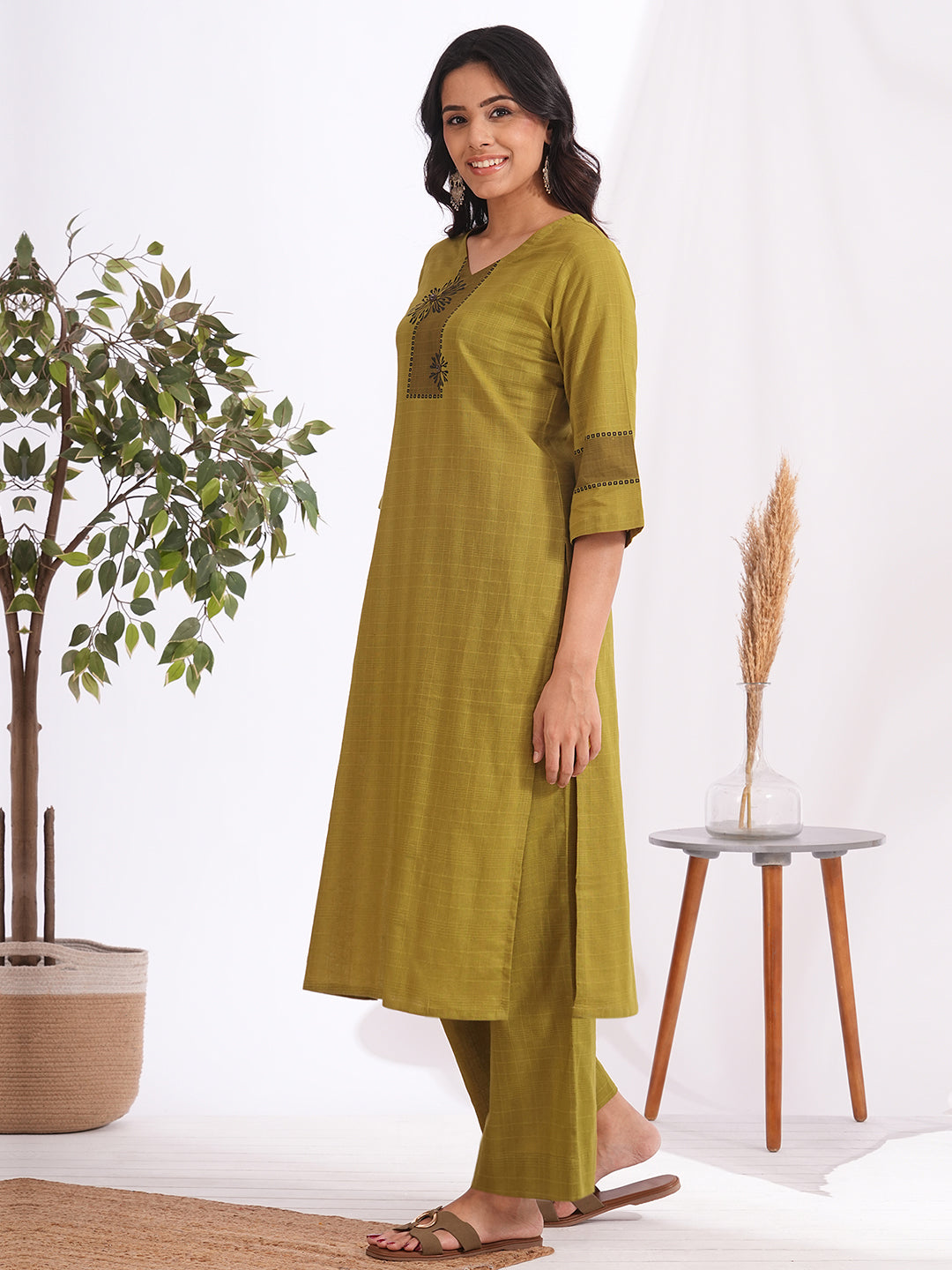 Straight fit woven checks kurta with asymmetrical block print highlighted with buttons and bell sleeves