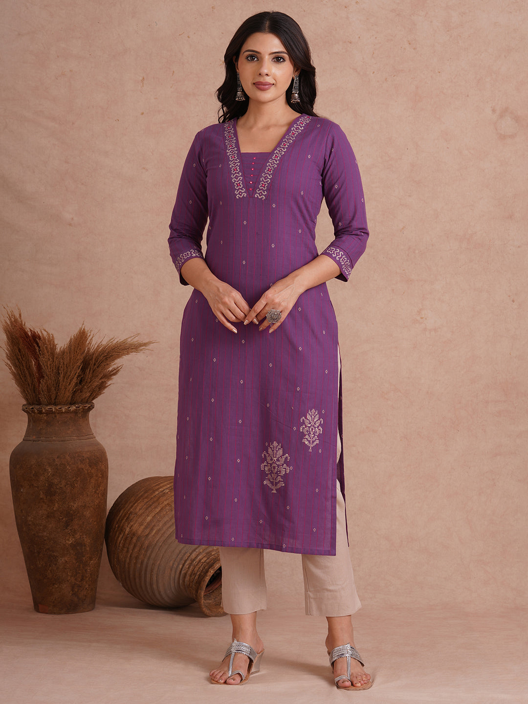Straight fit dobby stripe kurta with block printed neckline and placement block on hem.