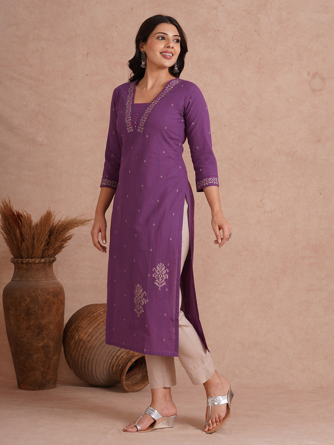 Straight fit dobby stripe kurta with block printed neckline and placement block on hem.
