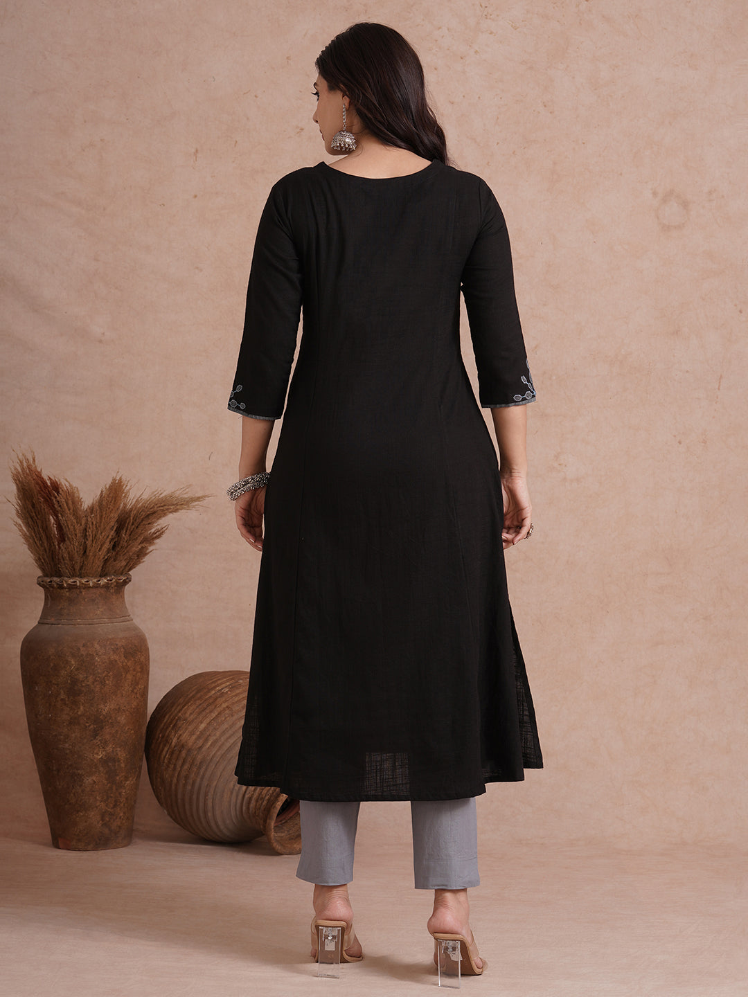 A-line shoulder princess kurta with machine applique on front and sleeves.