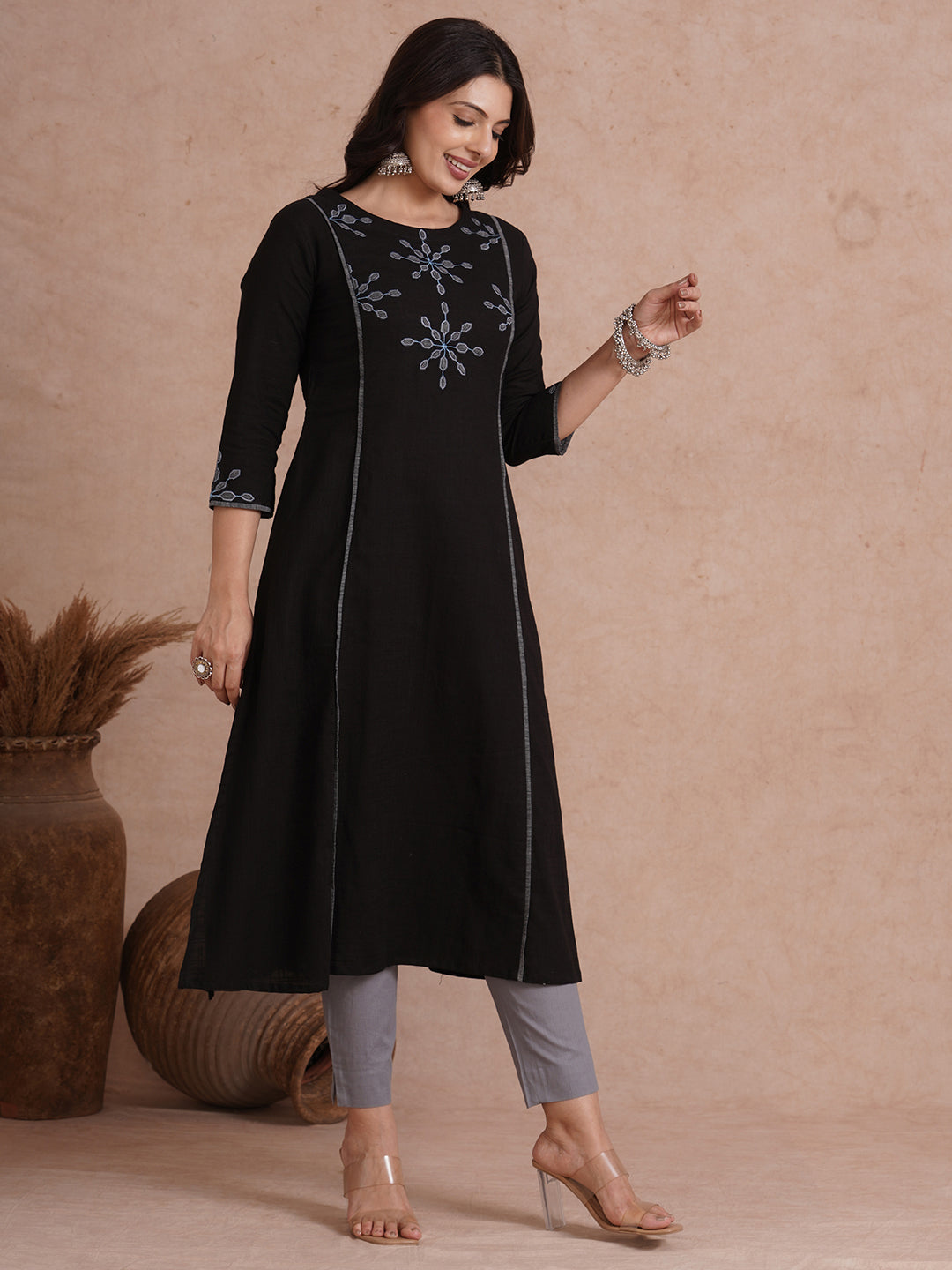 A-line shoulder princess kurta with machine applique on front and sleeves.