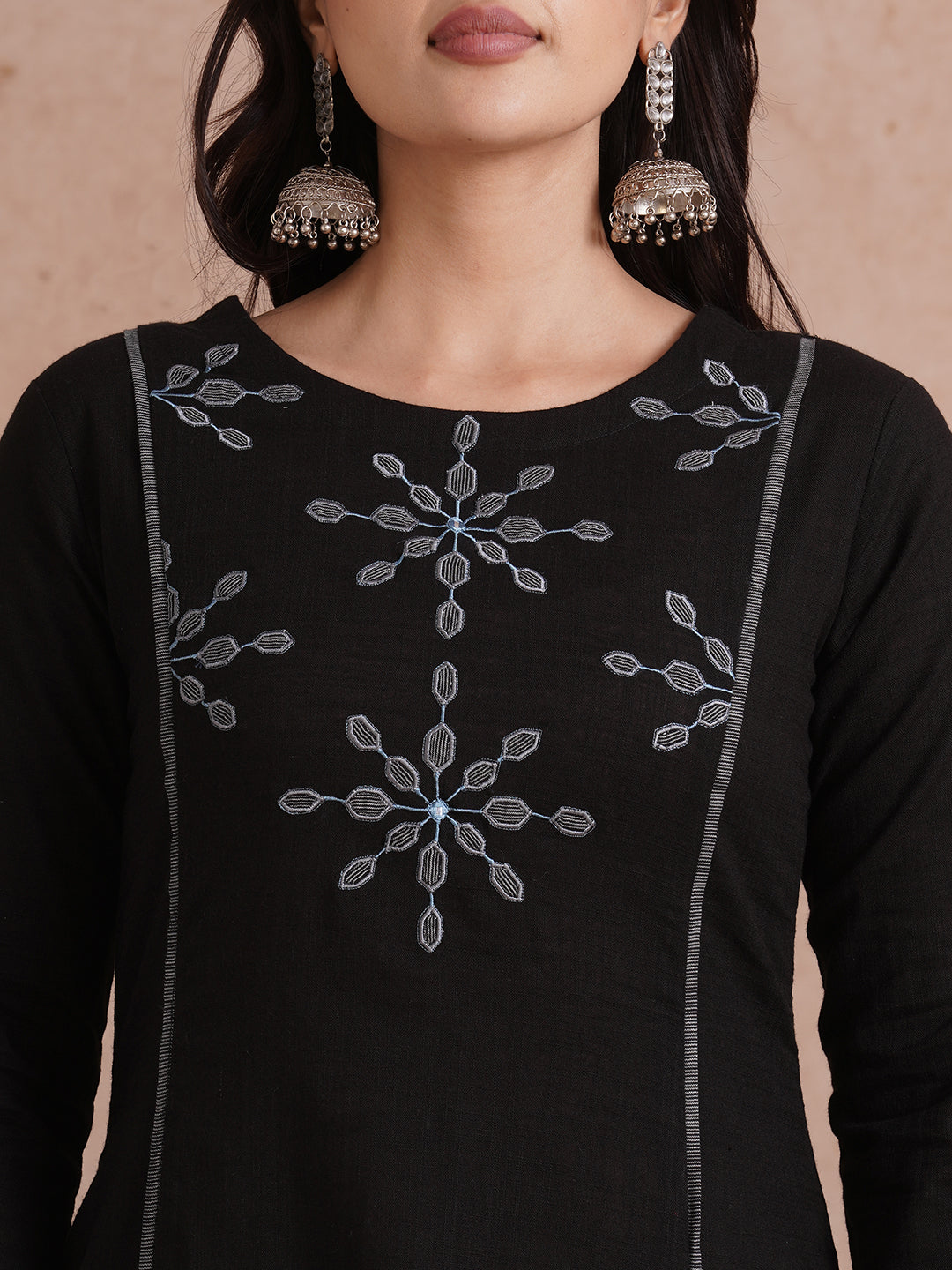 A-line shoulder princess kurta with machine applique on front and sleeves.