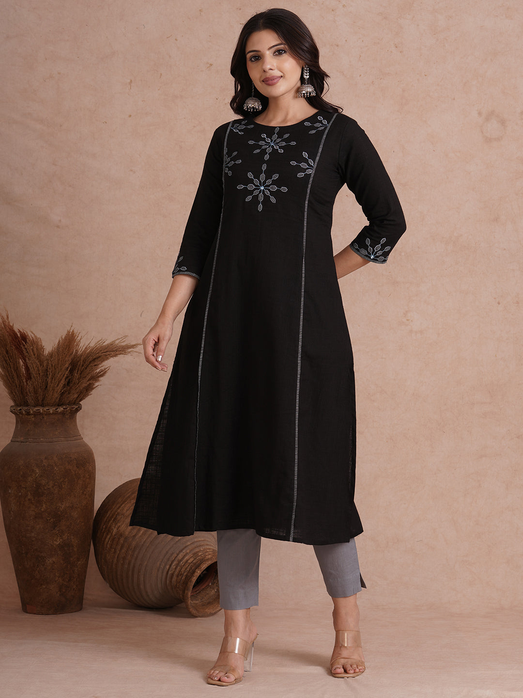 A-line shoulder princess kurta with machine applique on front and sleeves.