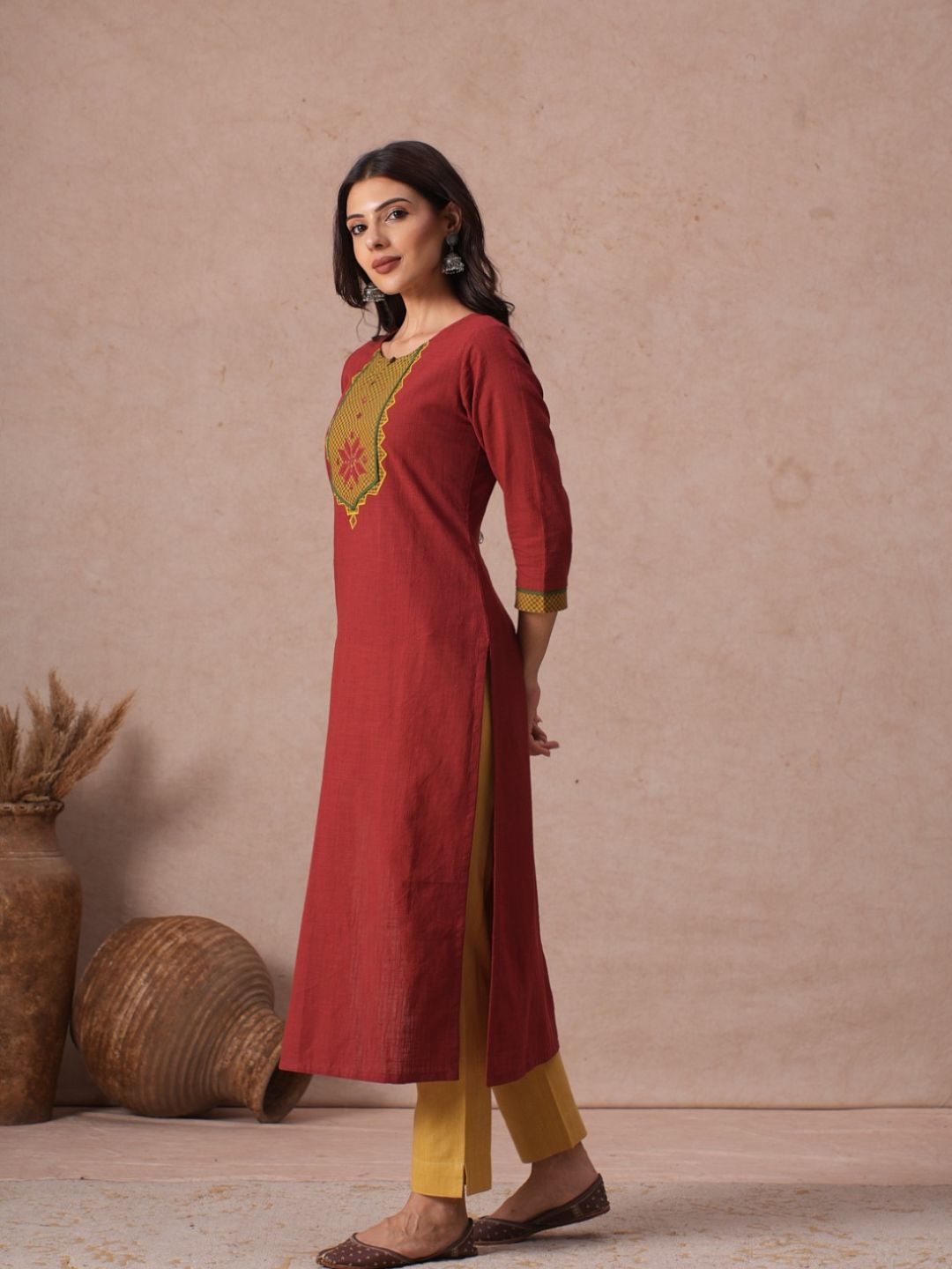 Cotton Straight Fit Kurta with Machine Applique and Contrast Fabric Sleeve Trims.