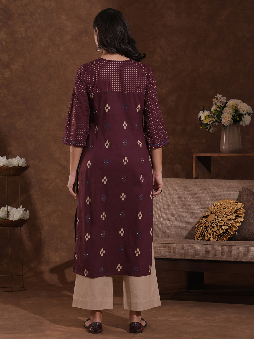 Printed straight fit kurta with shoulder yoke and tucks highlighted with handwork on yoke and sleeves.