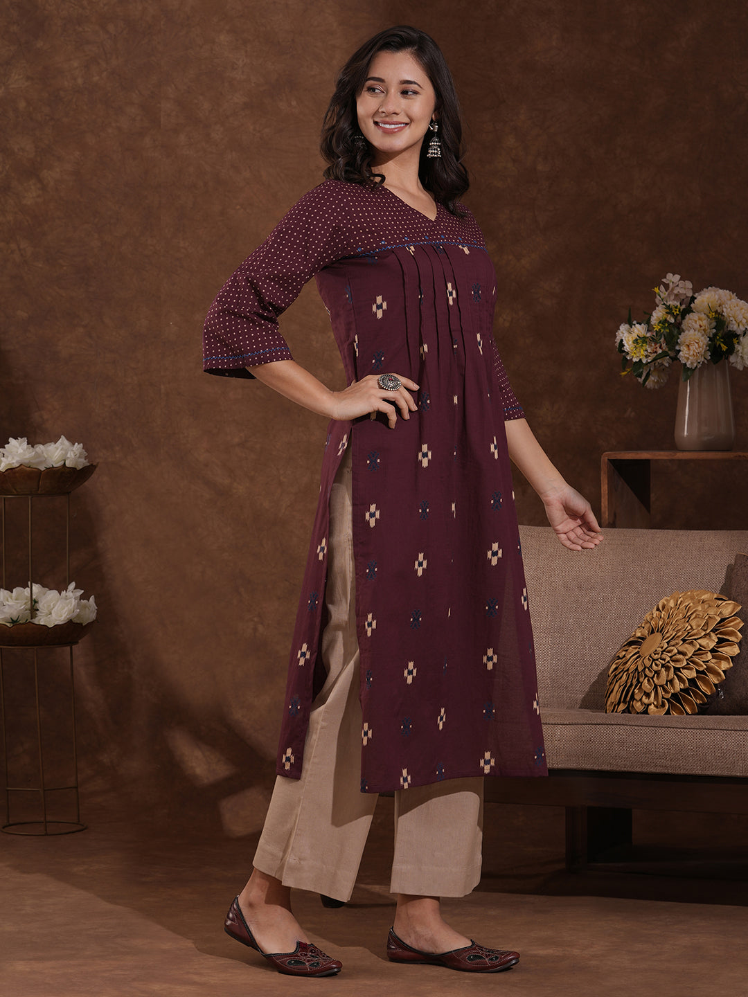 Printed straight fit kurta with shoulder yoke and tucks highlighted with handwork on yoke and sleeves.