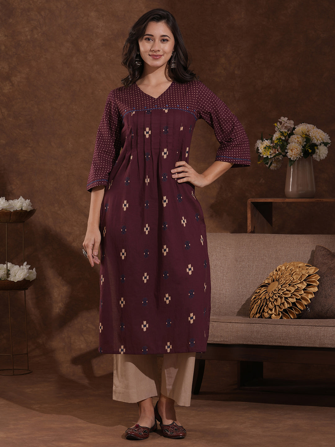 Printed straight fit kurta with shoulder yoke and tucks highlighted with handwork on yoke and sleeves.