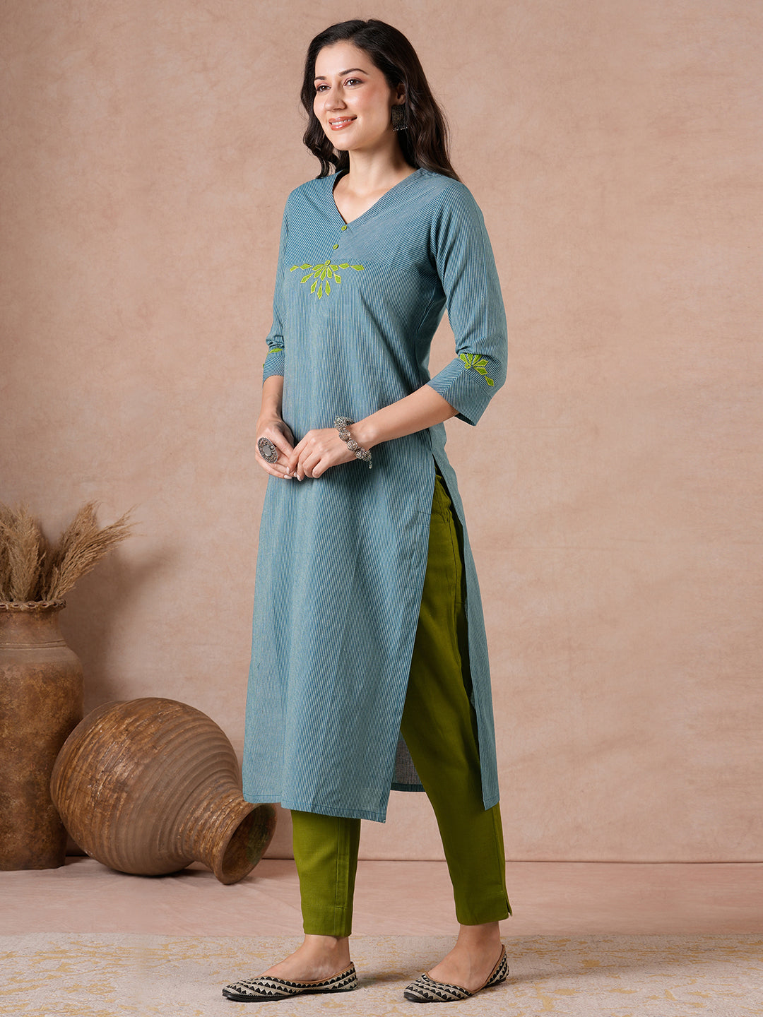 Straight Fit Cotton Kurta with Bias Yoke & Geometric Applique Detail.