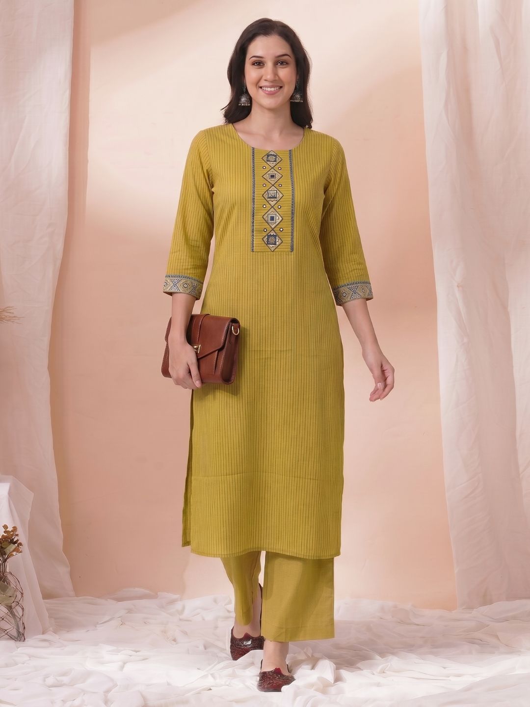 Straight Fit Cotton Striped Kurta with Kalamkari Applique & Piping Details.