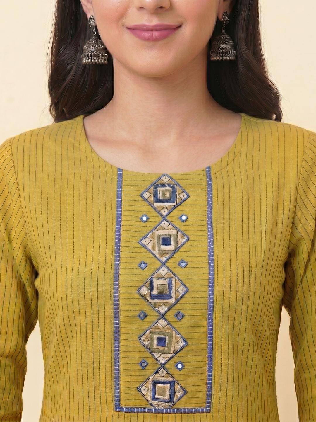 Straight Fit Cotton Striped Kurta with Kalamkari Applique & Piping Details.
