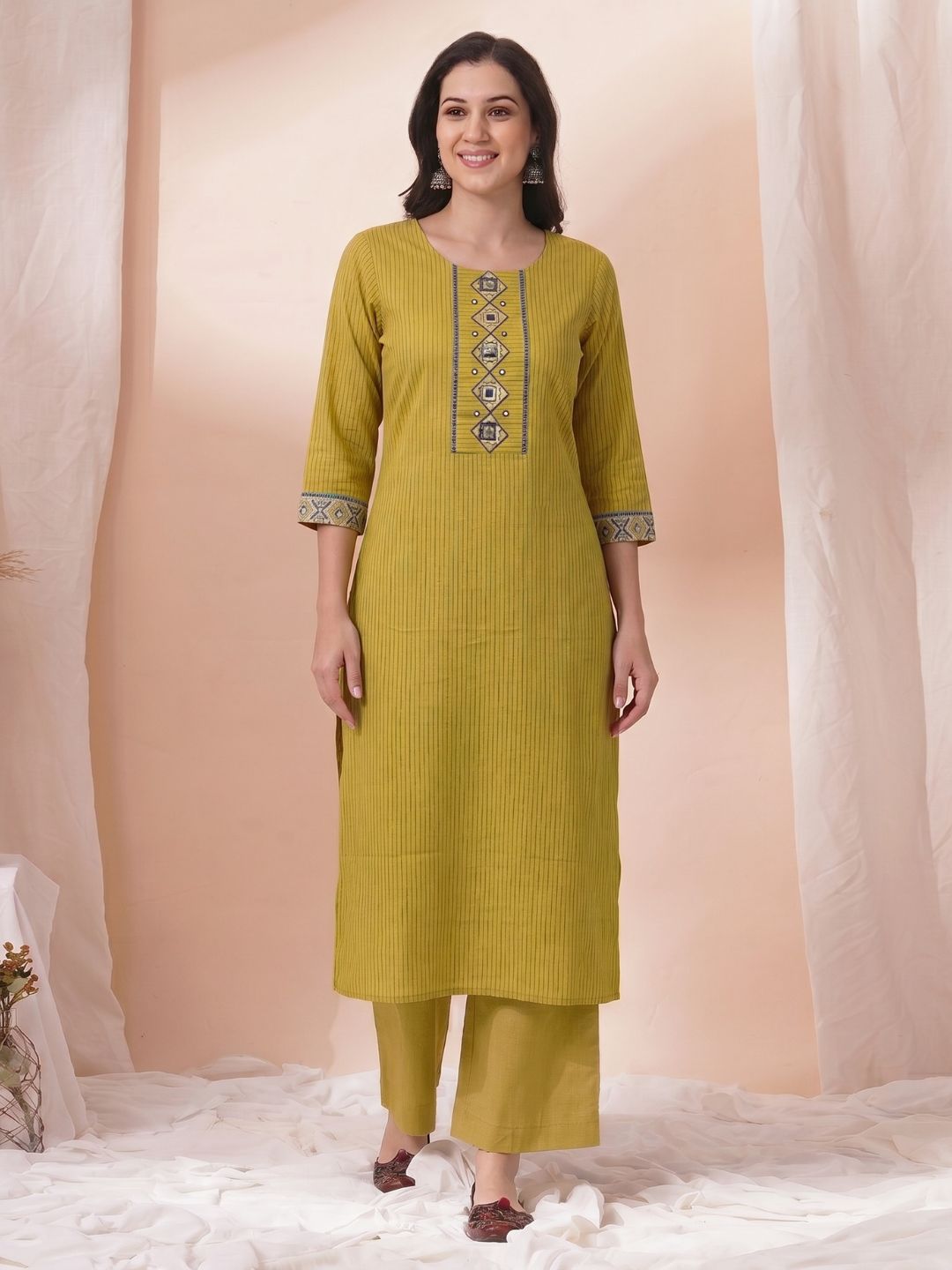 Straight Fit Cotton Striped Kurta with Kalamkari Applique & Piping Details.