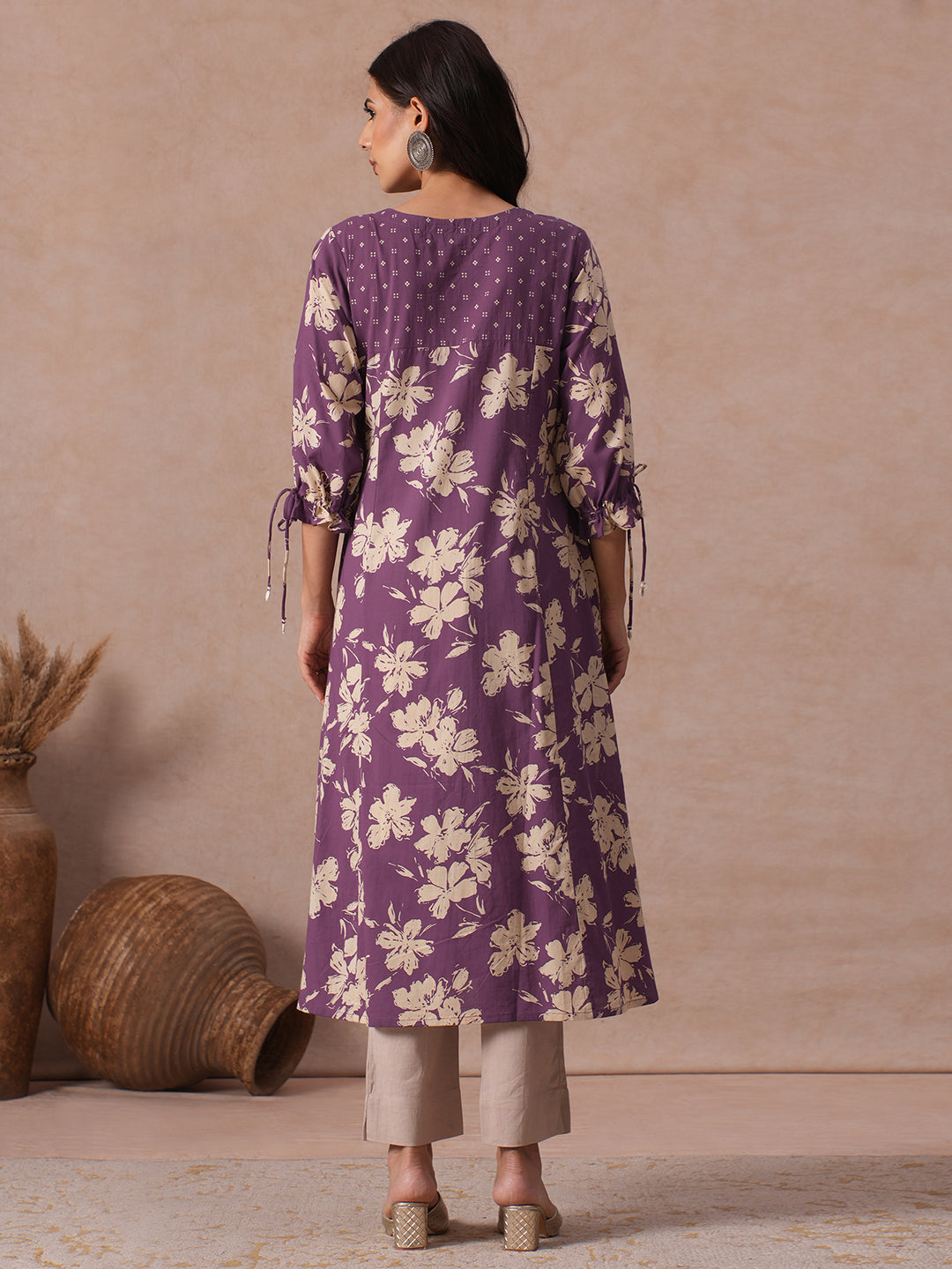 A-line Printed Cotton Kurta with Hand Sequined Yoke and Stylish Tie-Up Sleeves.