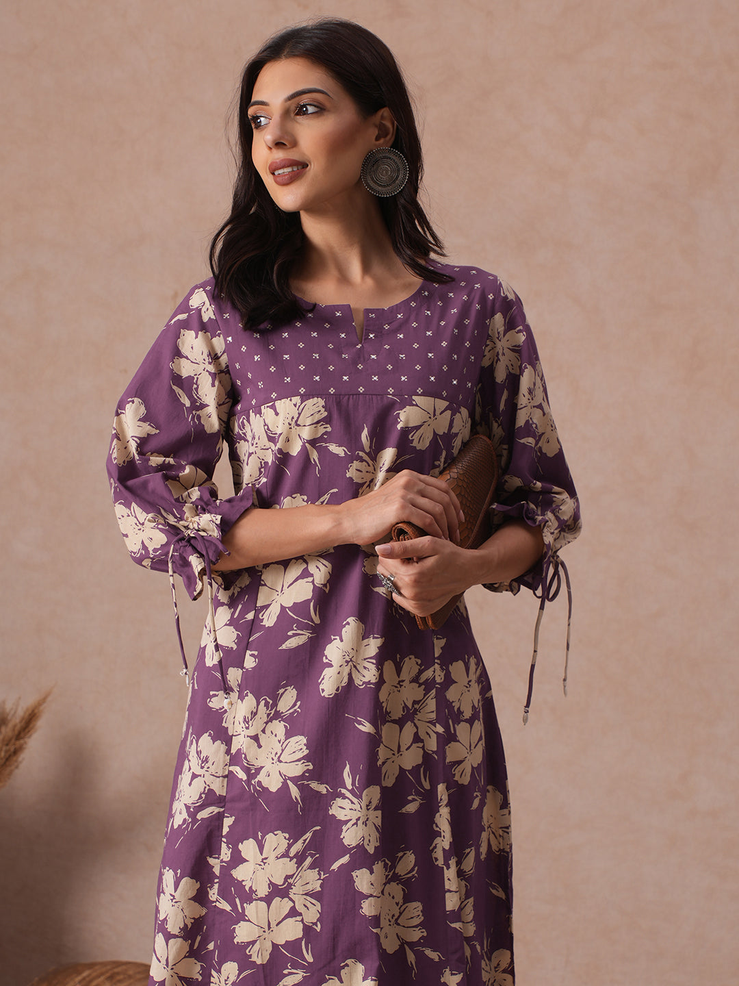 A-line Printed Cotton Kurta with Hand Sequined Yoke and Stylish Tie-Up Sleeves.