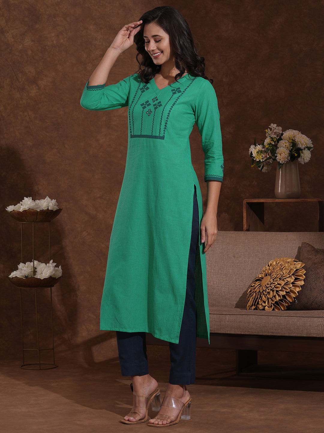 Straight fit kurta with block printed yoke and sleeves highlighted with handwork mirrors.