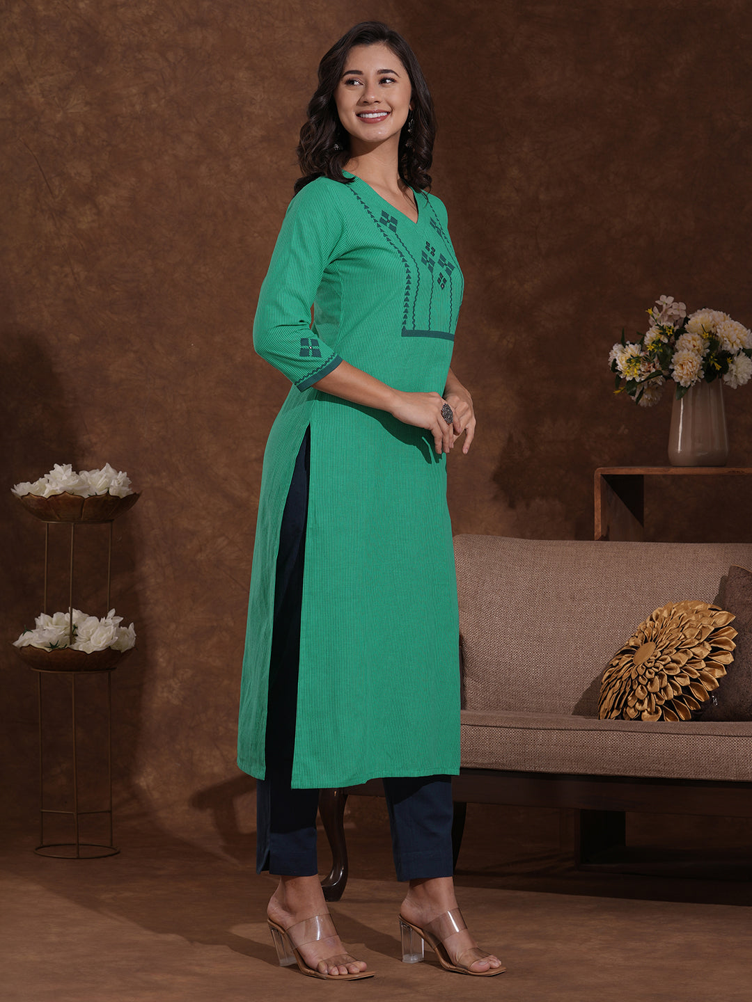 Straight fit kurta with block printed yoke and sleeves highlighted with handwork mirrors.