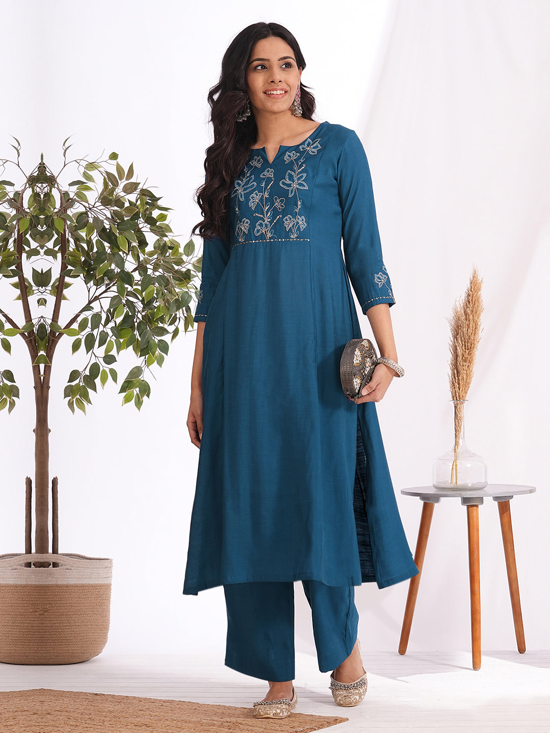 A-line kurta in silk blend fabric with Zari and thread embroidery paired with lined palazzo