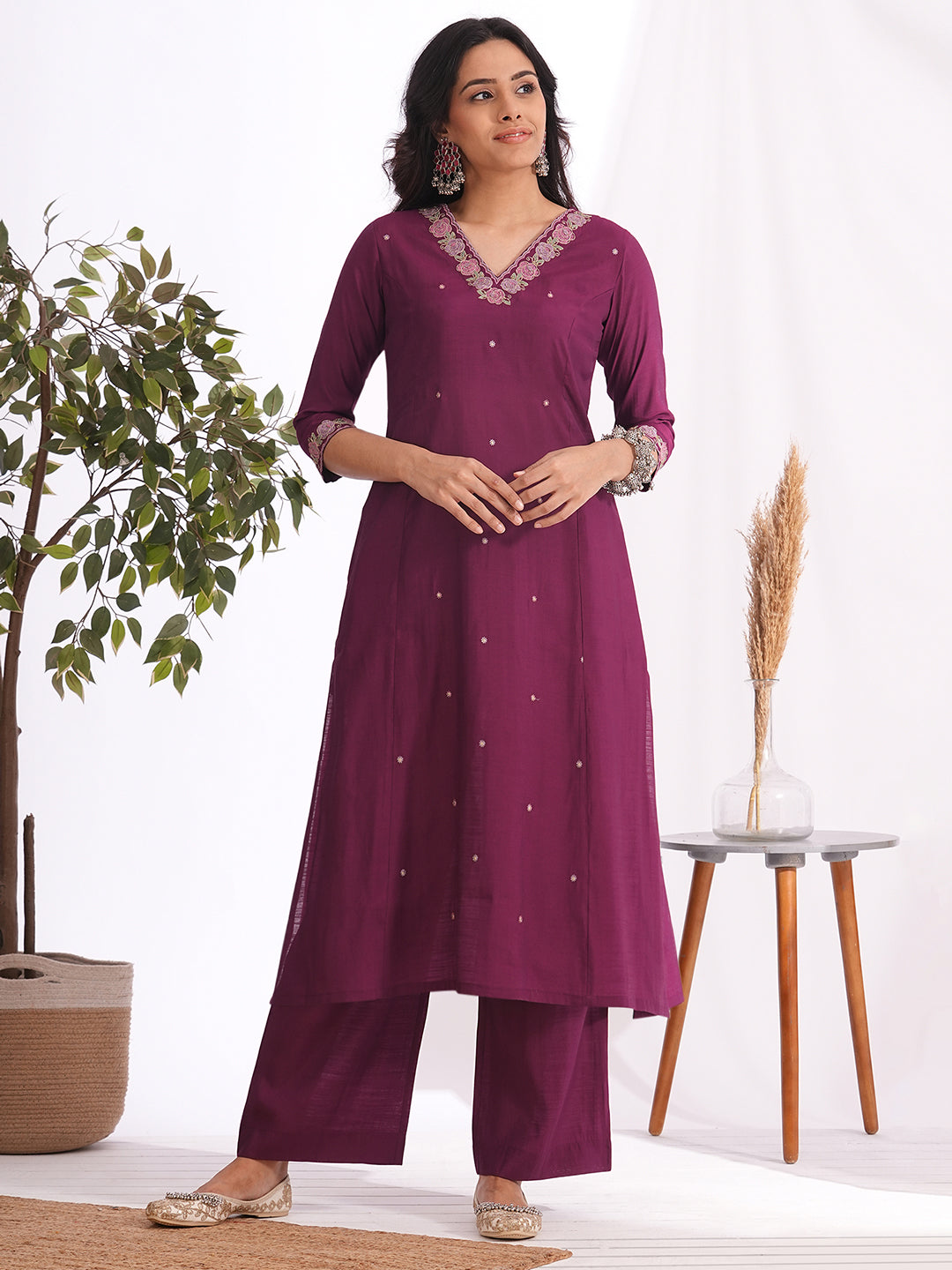 A-line kurta in silk blend fabric with thread and Zari embroidery paired with lined art silk palazzo