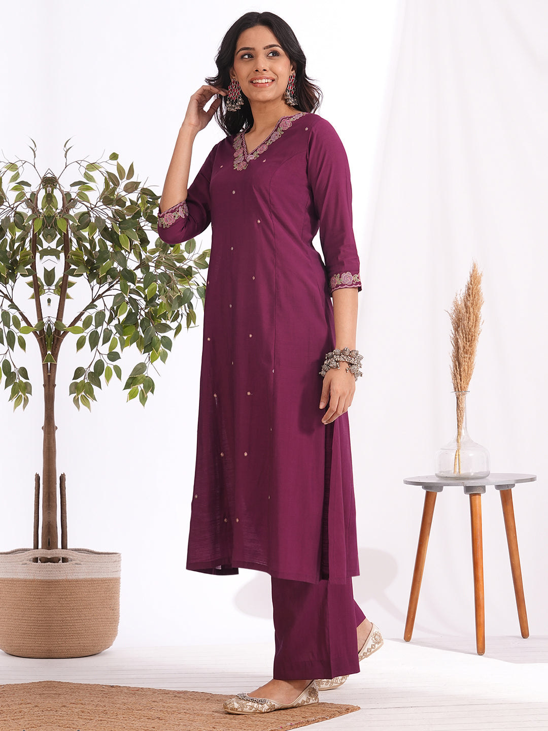 A-line kurta in silk blend fabric with thread and Zari embroidery paired with lined art silk palazzo