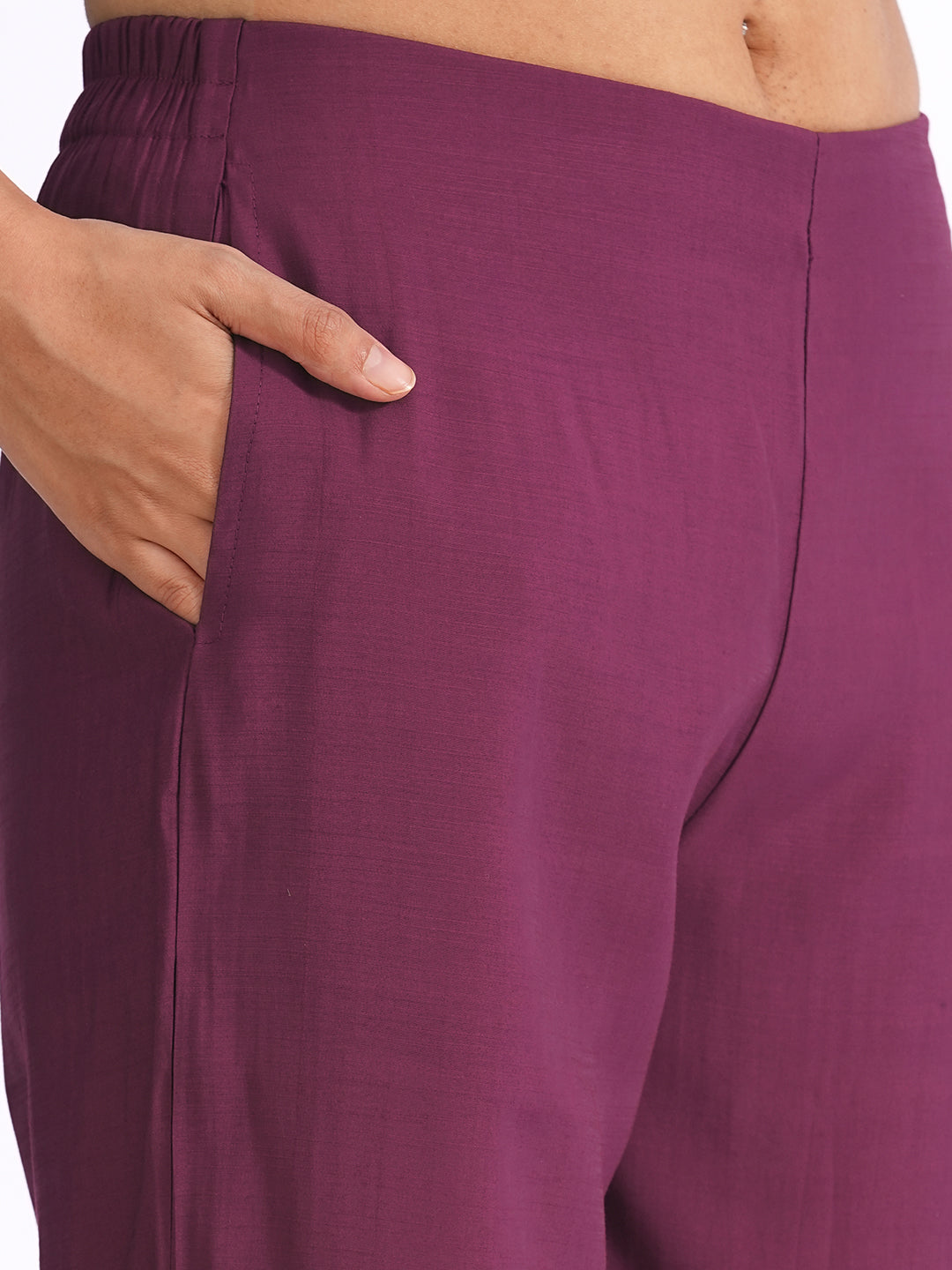 A-line kurta in silk blend fabric with thread and Zari embroidery paired with lined art silk palazzo