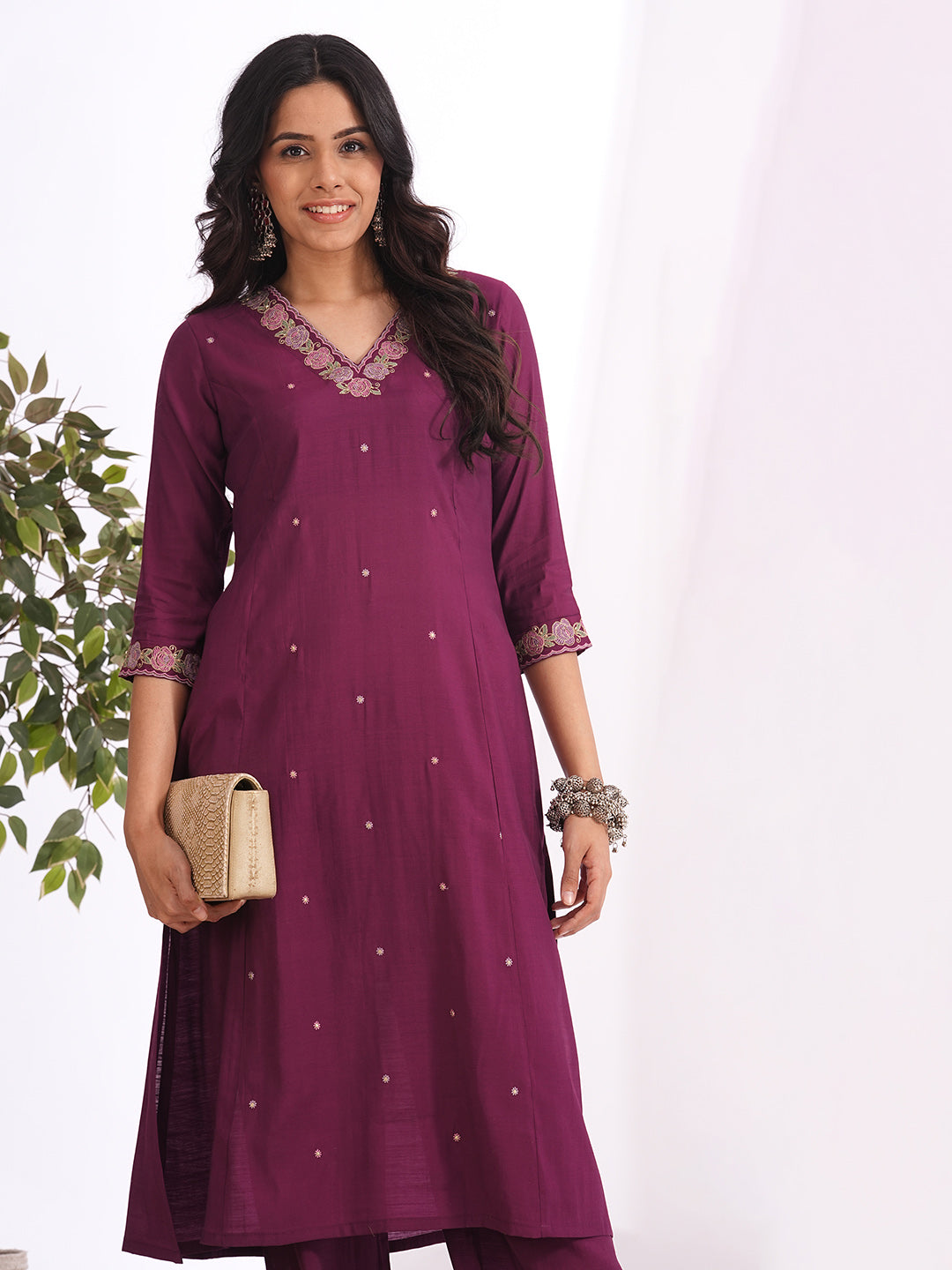 A-line kurta in silk blend fabric with thread and Zari embroidery paired with lined art silk palazzo