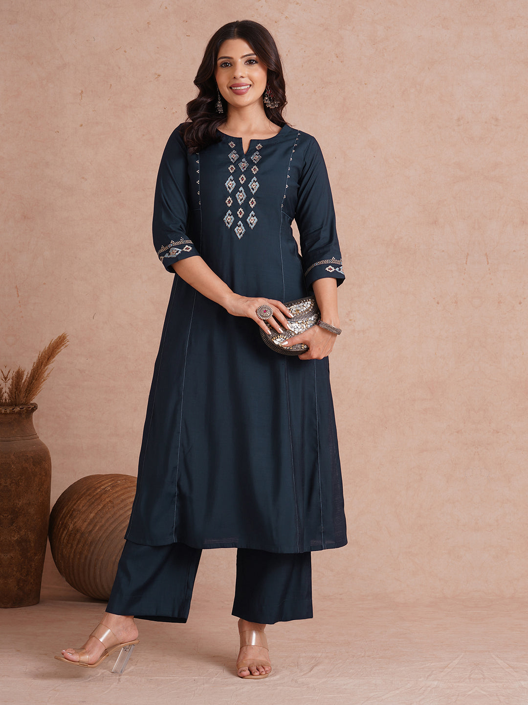 Party Edit- Pocketed and embroidered kurta in art silk fabric paired with lined art silk palazzo.