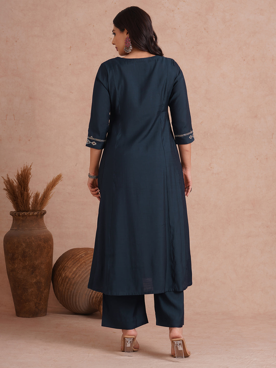 Party Edit- Pocketed and embroidered kurta in art silk fabric paired with lined art silk palazzo.