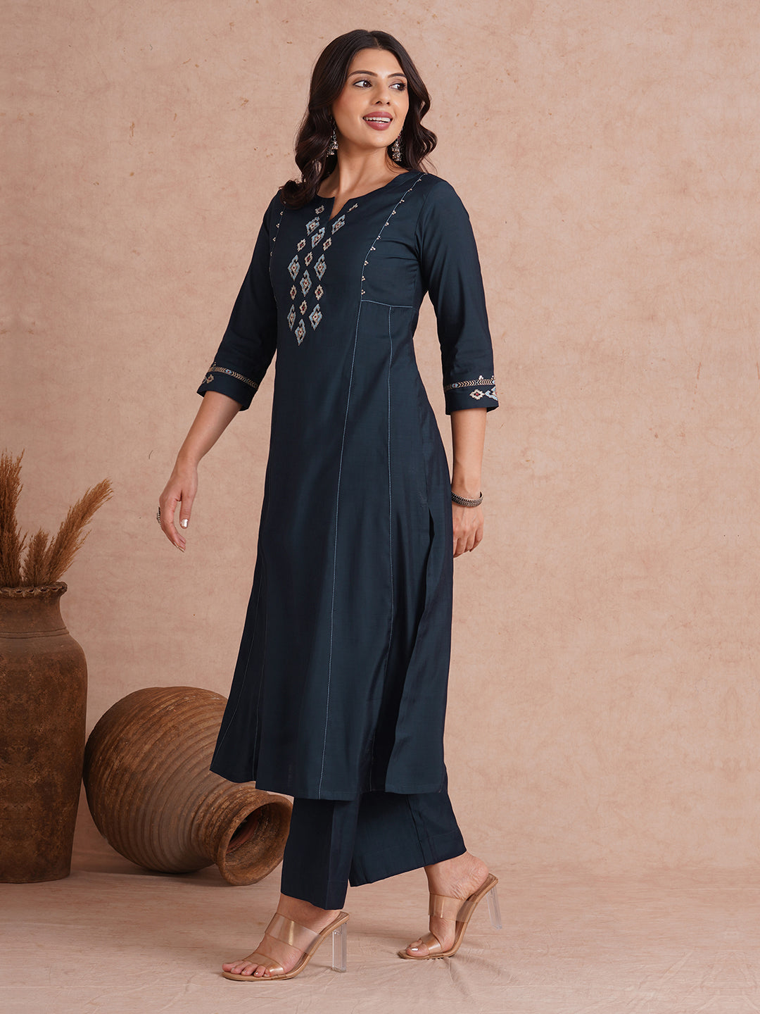 Party Edit- Pocketed and embroidered kurta in art silk fabric paired with lined art silk palazzo.