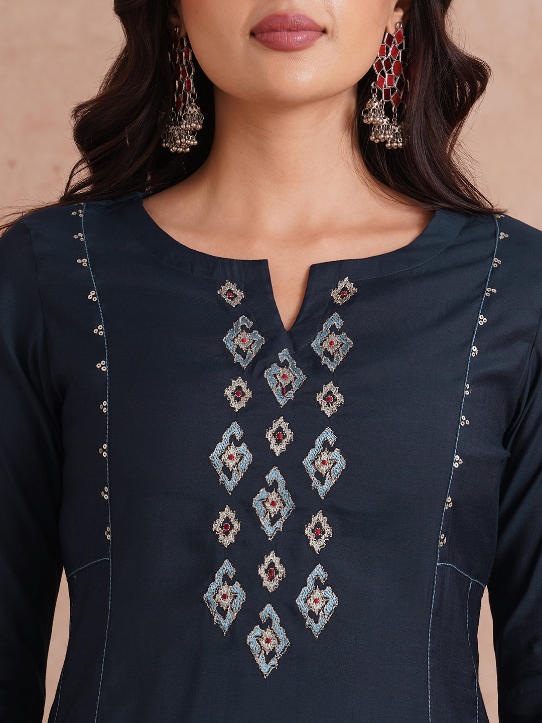 Party Edit- Pocketed and embroidered kurta in art silk fabric paired with lined art silk palazzo.