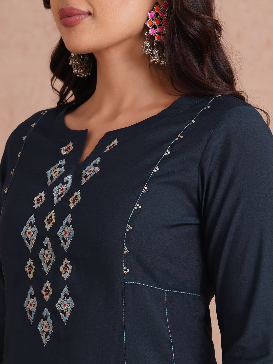 Party Edit- Pocketed and embroidered kurta in art silk fabric paired with lined art silk palazzo.