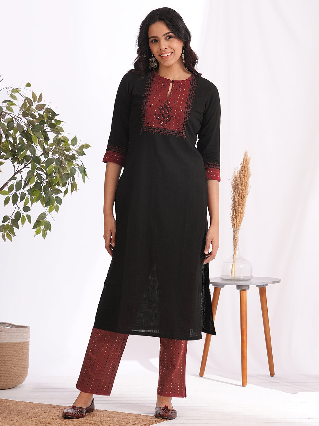 Straight fit kurta set with Yoke and sleeves highlighted with block print and handwork