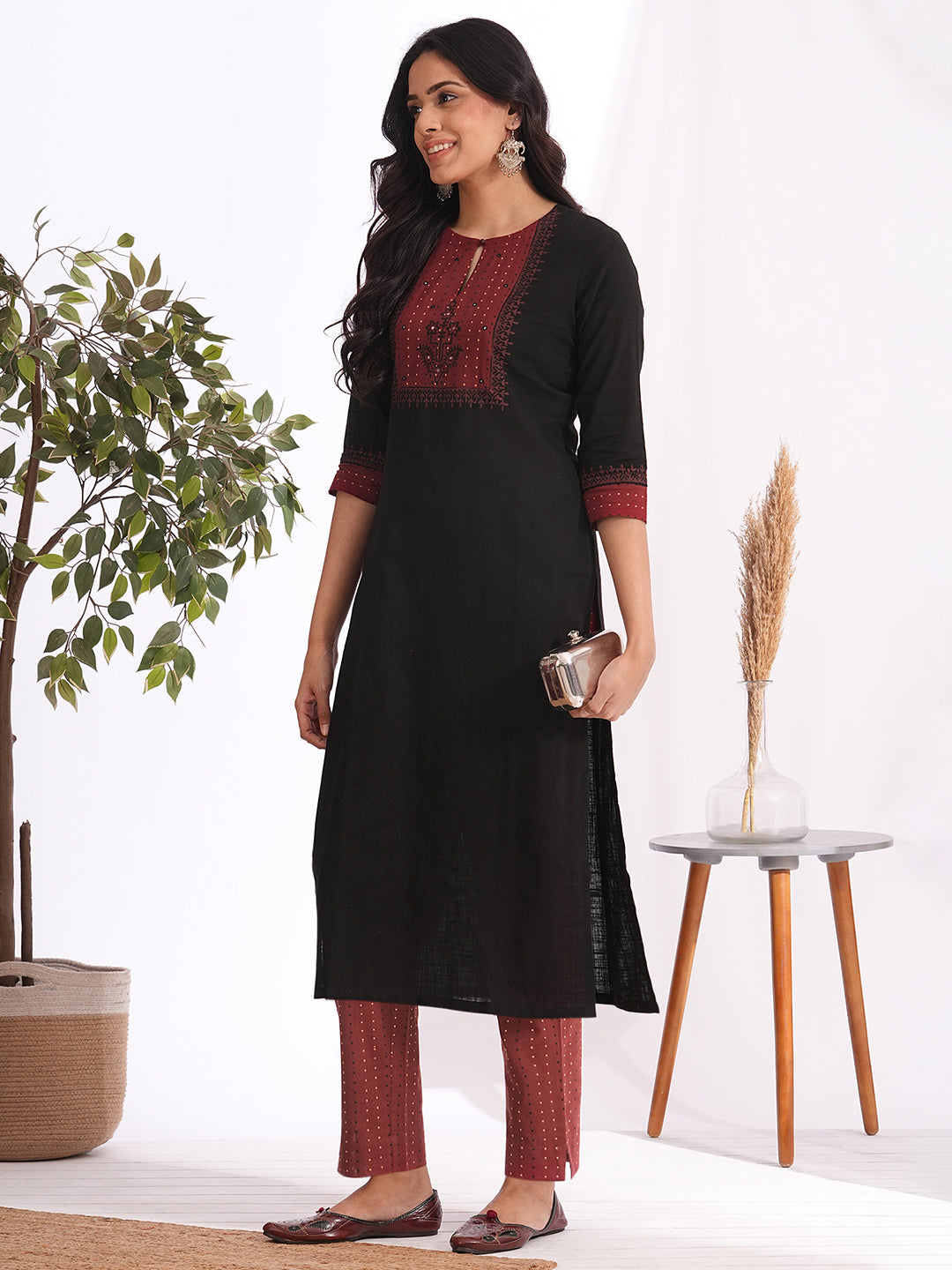 Straight fit kurta set with Yoke and sleeves highlighted with block print and handwork