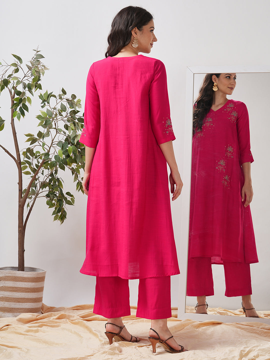 Party Edit- A tent fit kurta set with placement embroidery on the front and sleeves, paired with palazzo.
