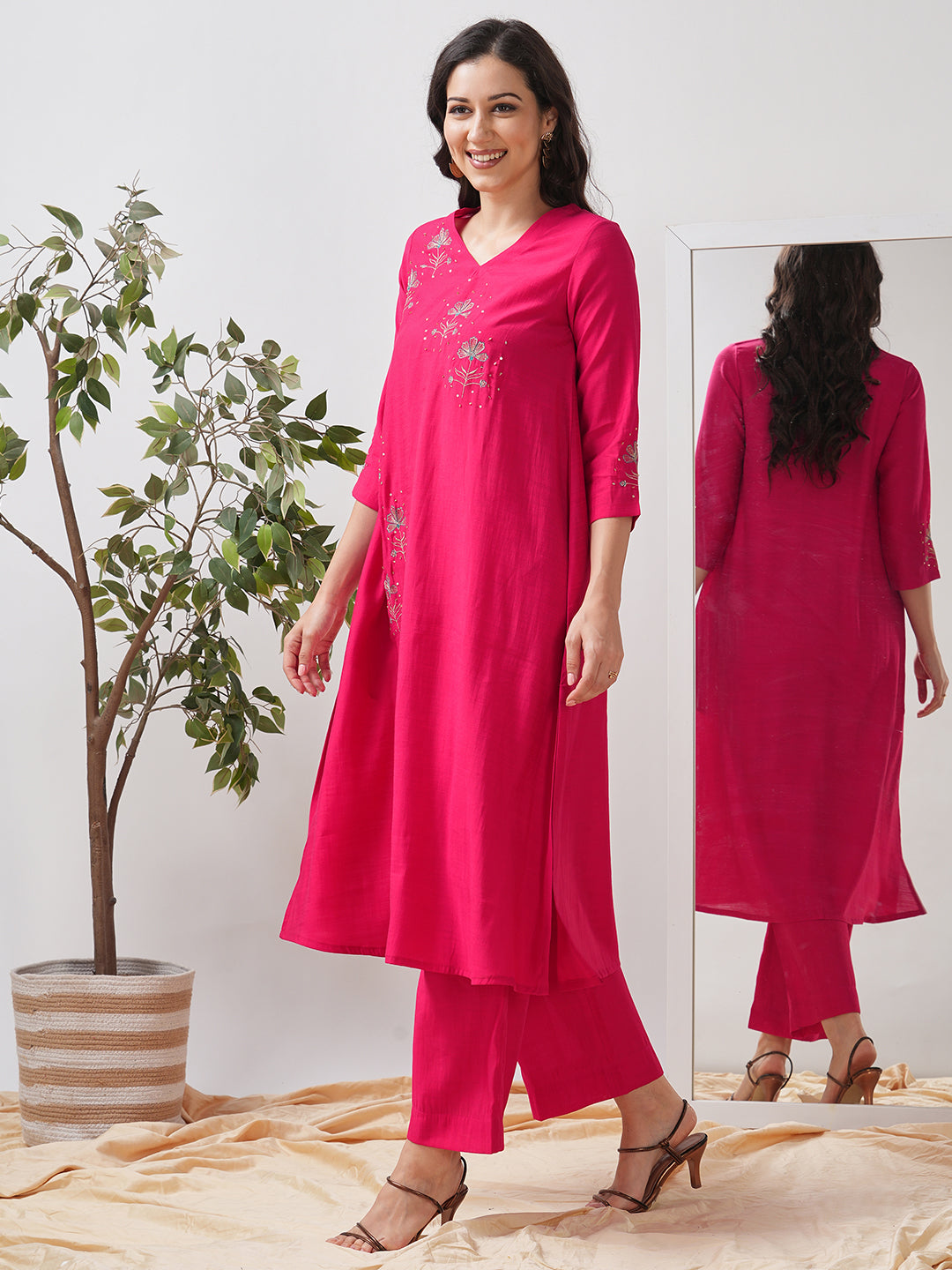Party Edit- A tent fit kurta set with placement embroidery on the front and sleeves, paired with palazzo.