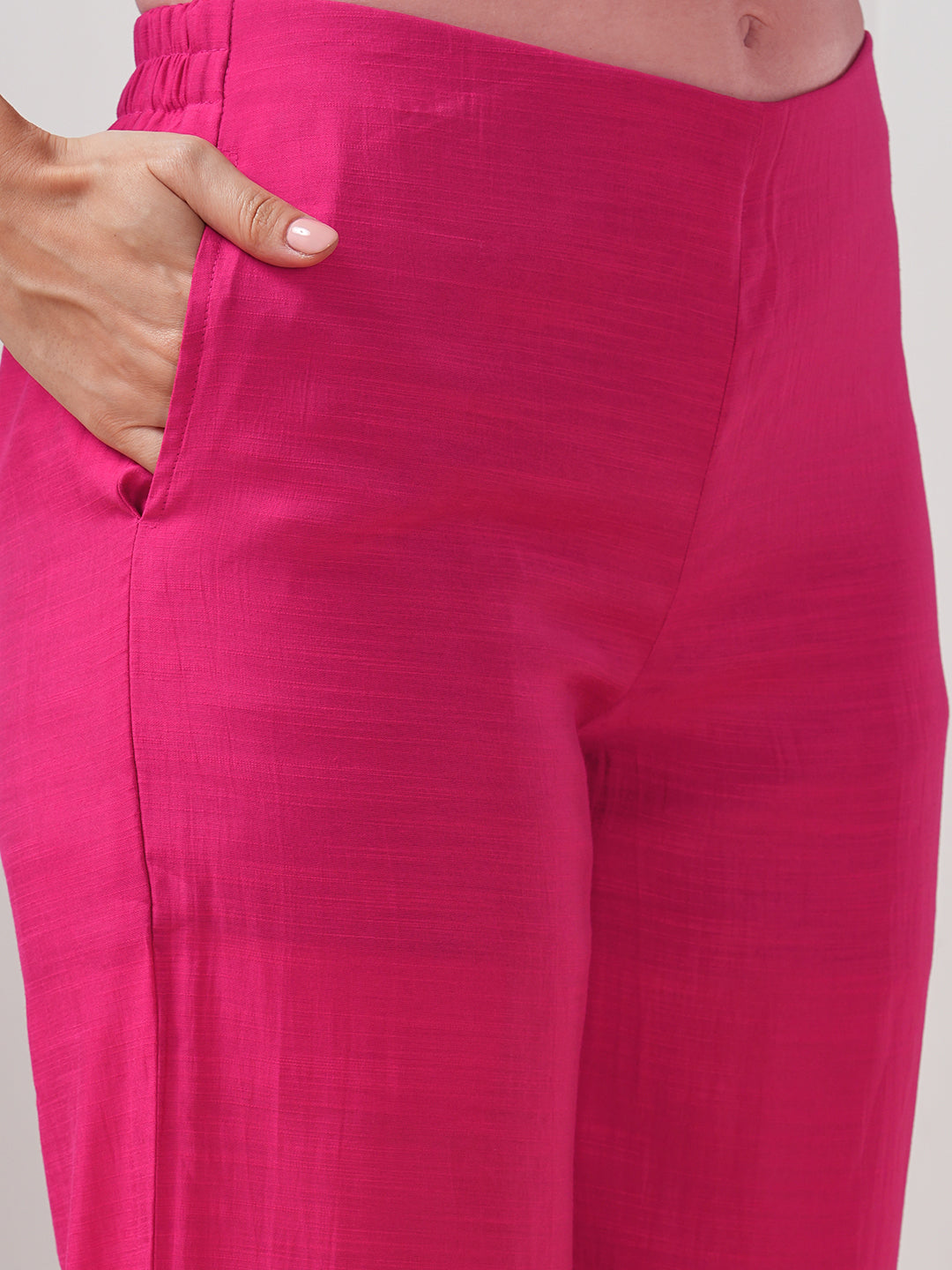 Party Edit- A tent fit kurta set with placement embroidery on the front and sleeves, paired with palazzo.