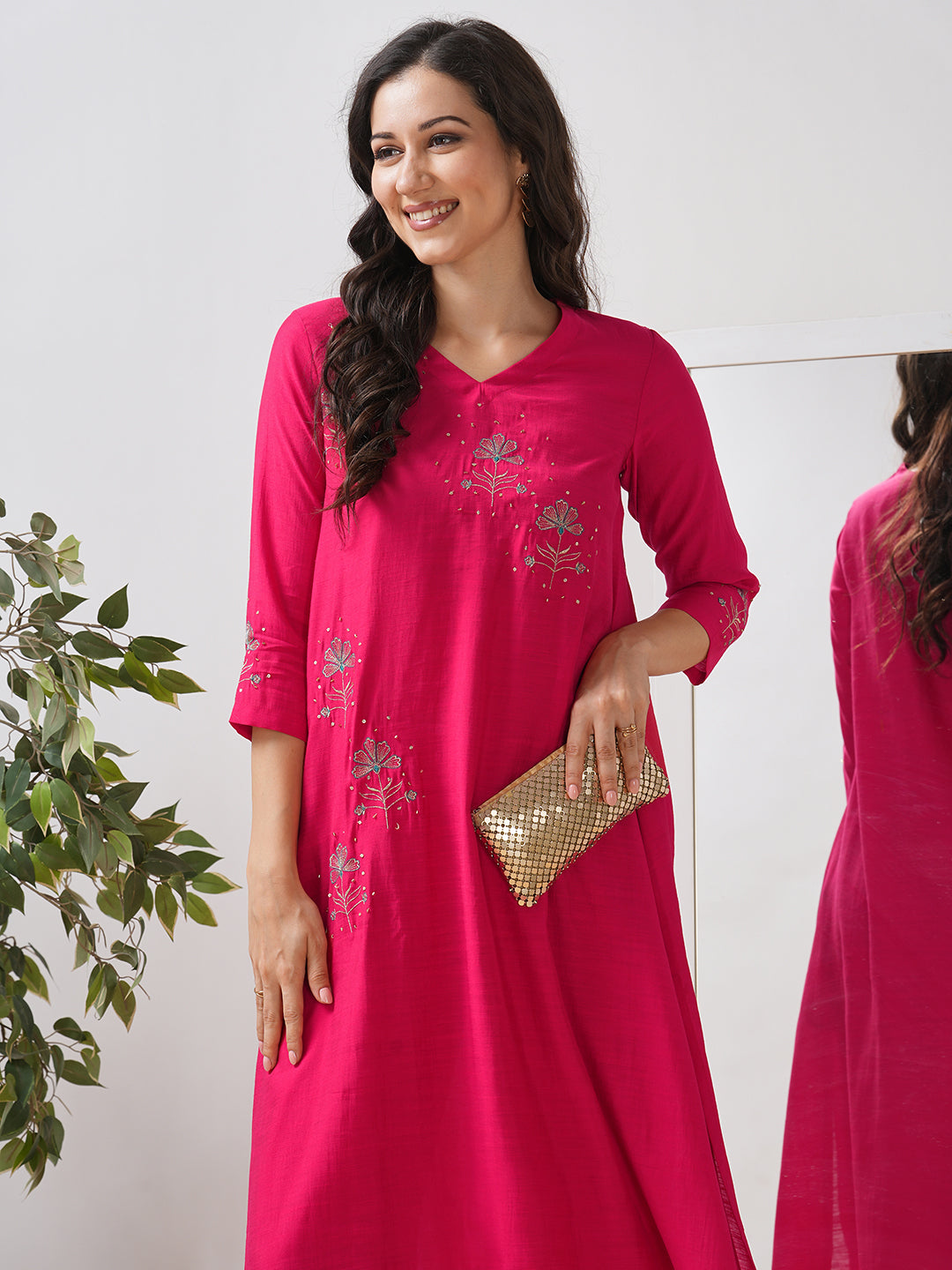 Party Edit- A tent fit kurta set with placement embroidery on the front and sleeves, paired with palazzo.