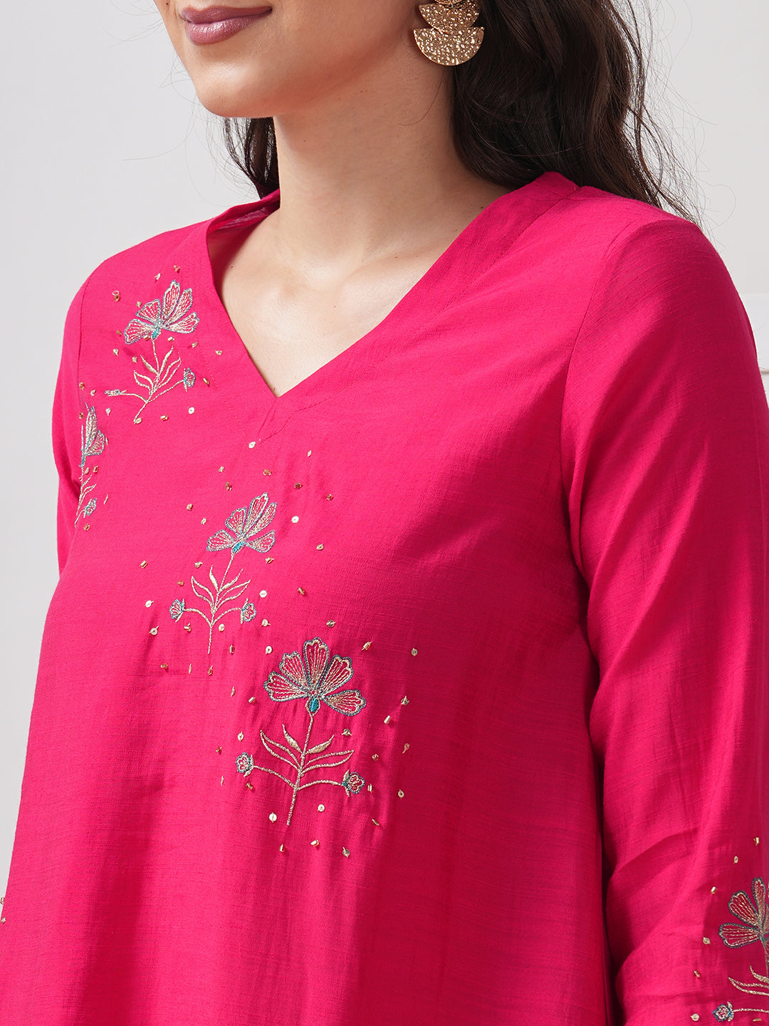 Party Edit- A tent fit kurta set with placement embroidery on the front and sleeves, paired with palazzo.