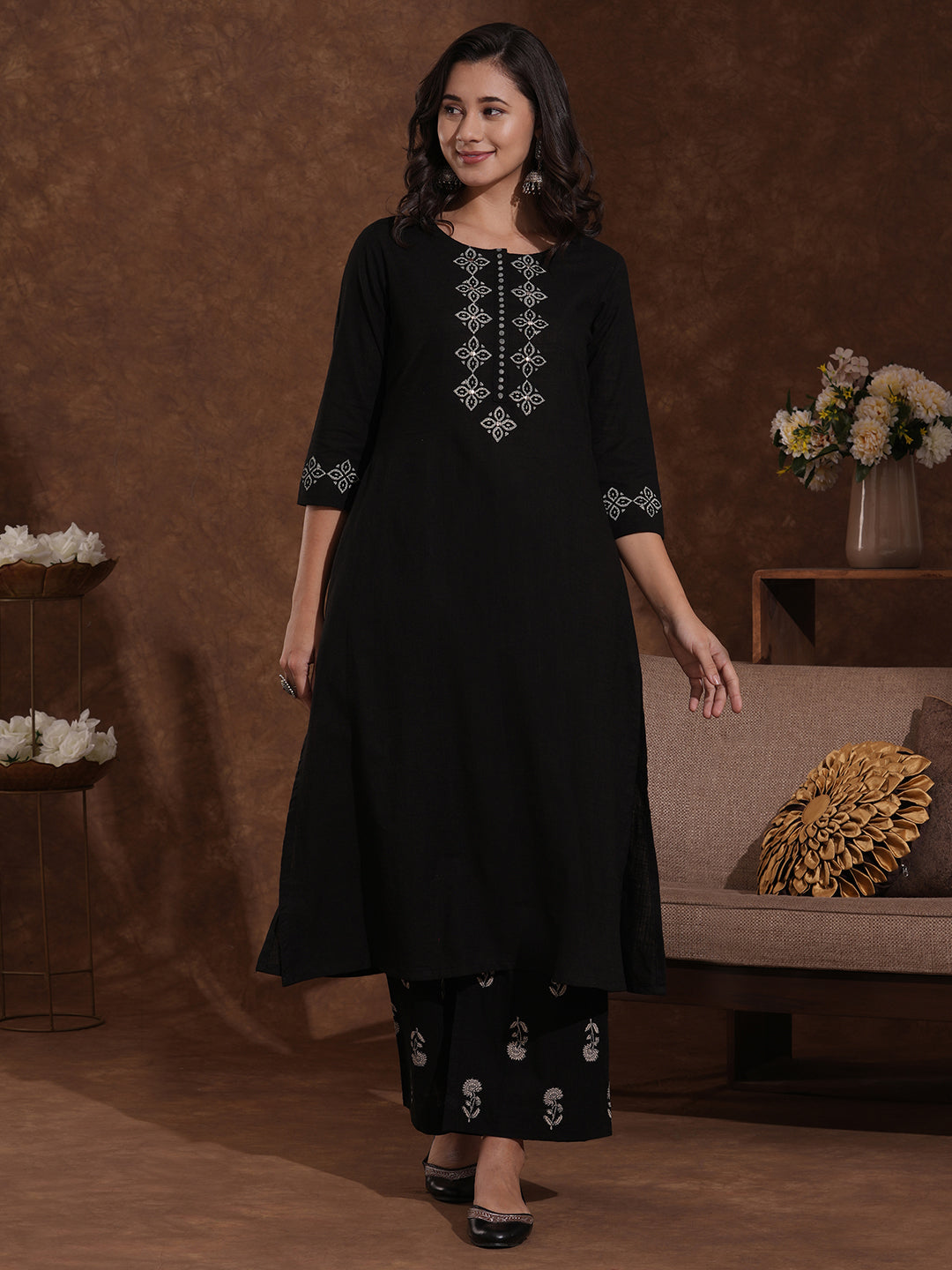 A-line kurta with block printed front and sleeves paired with printed palazzos.