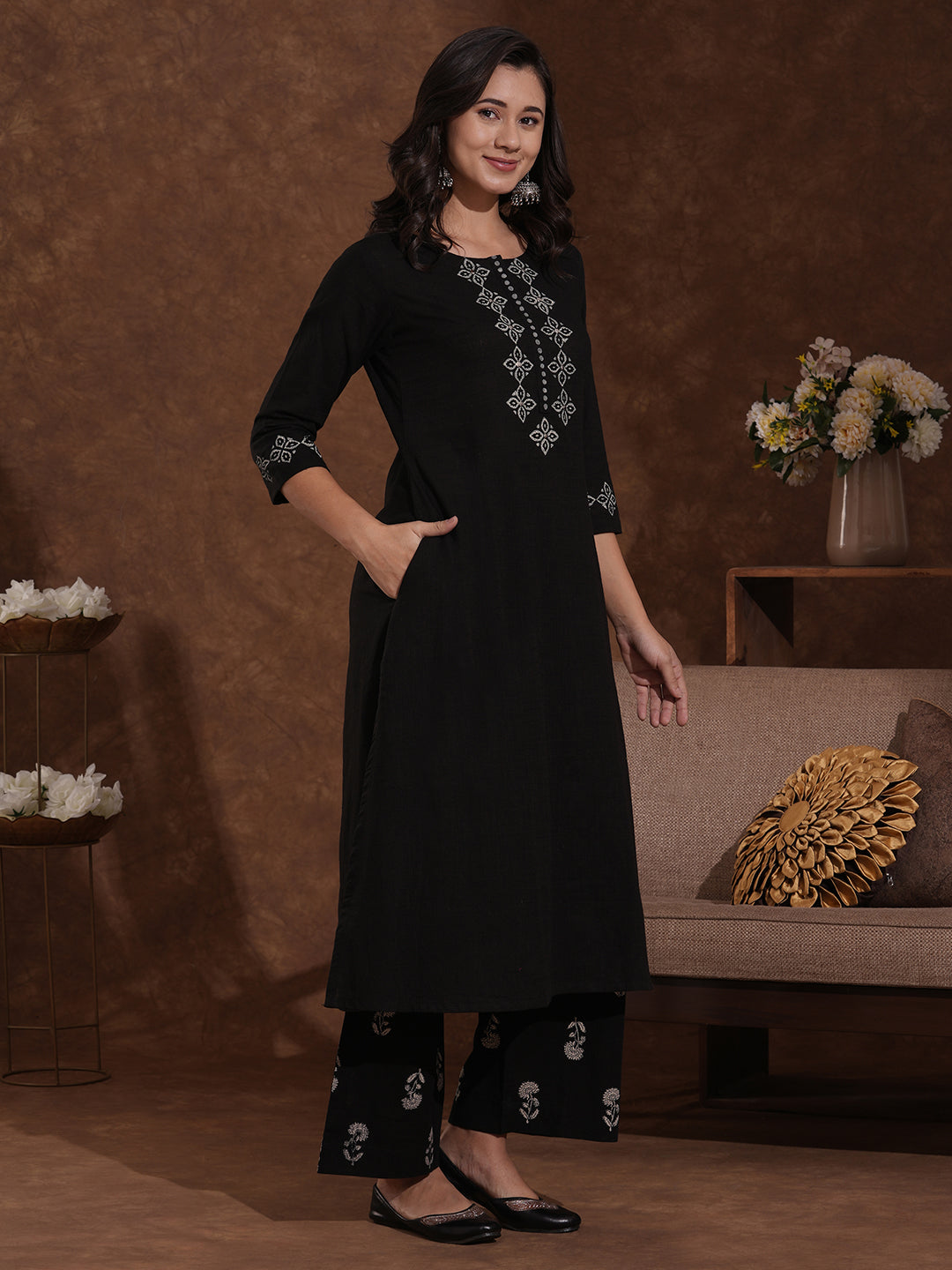 A-line kurta with block printed front and sleeves paired with printed palazzos.