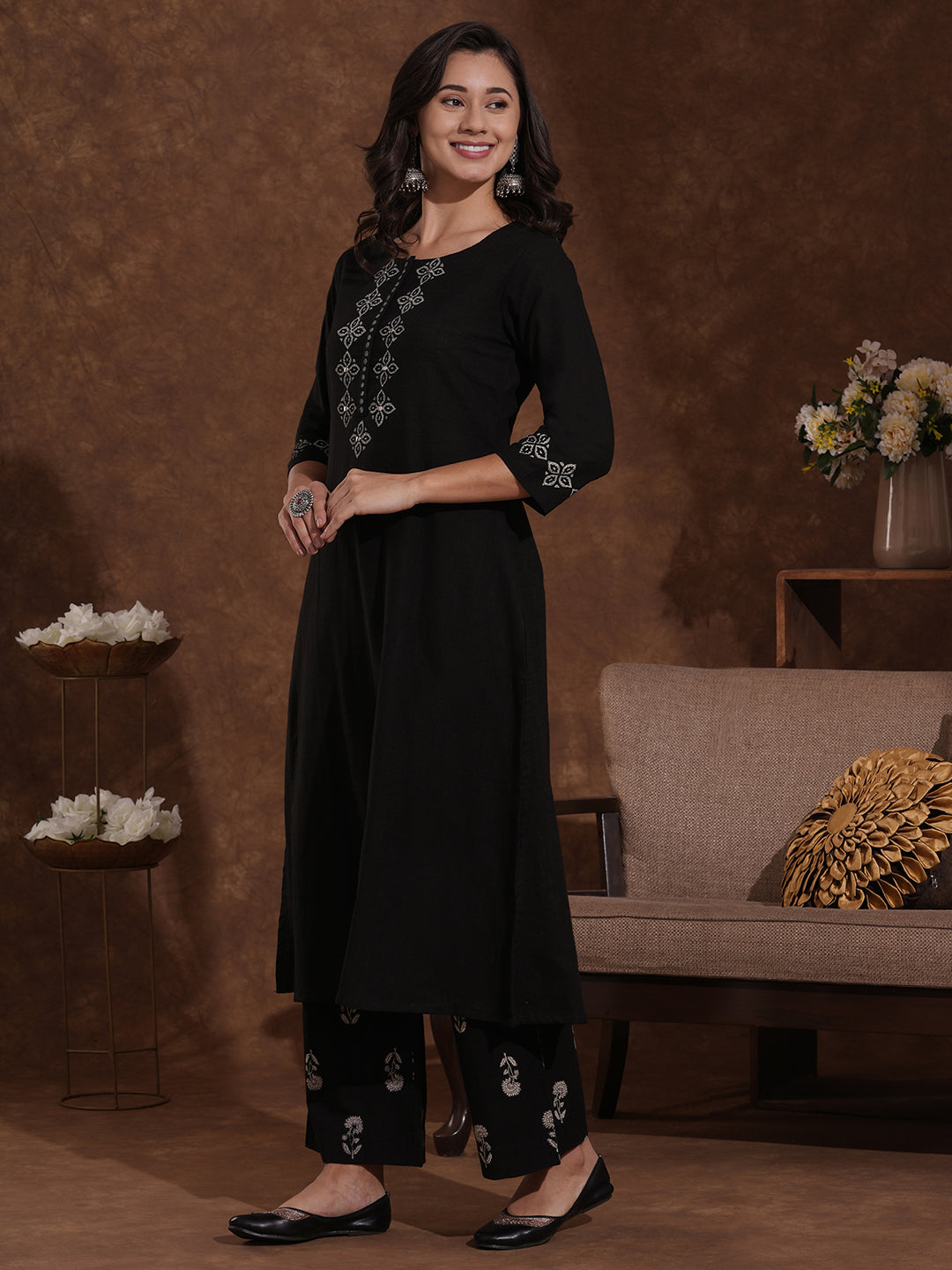 A-line kurta with block printed front and sleeves paired with printed palazzos.