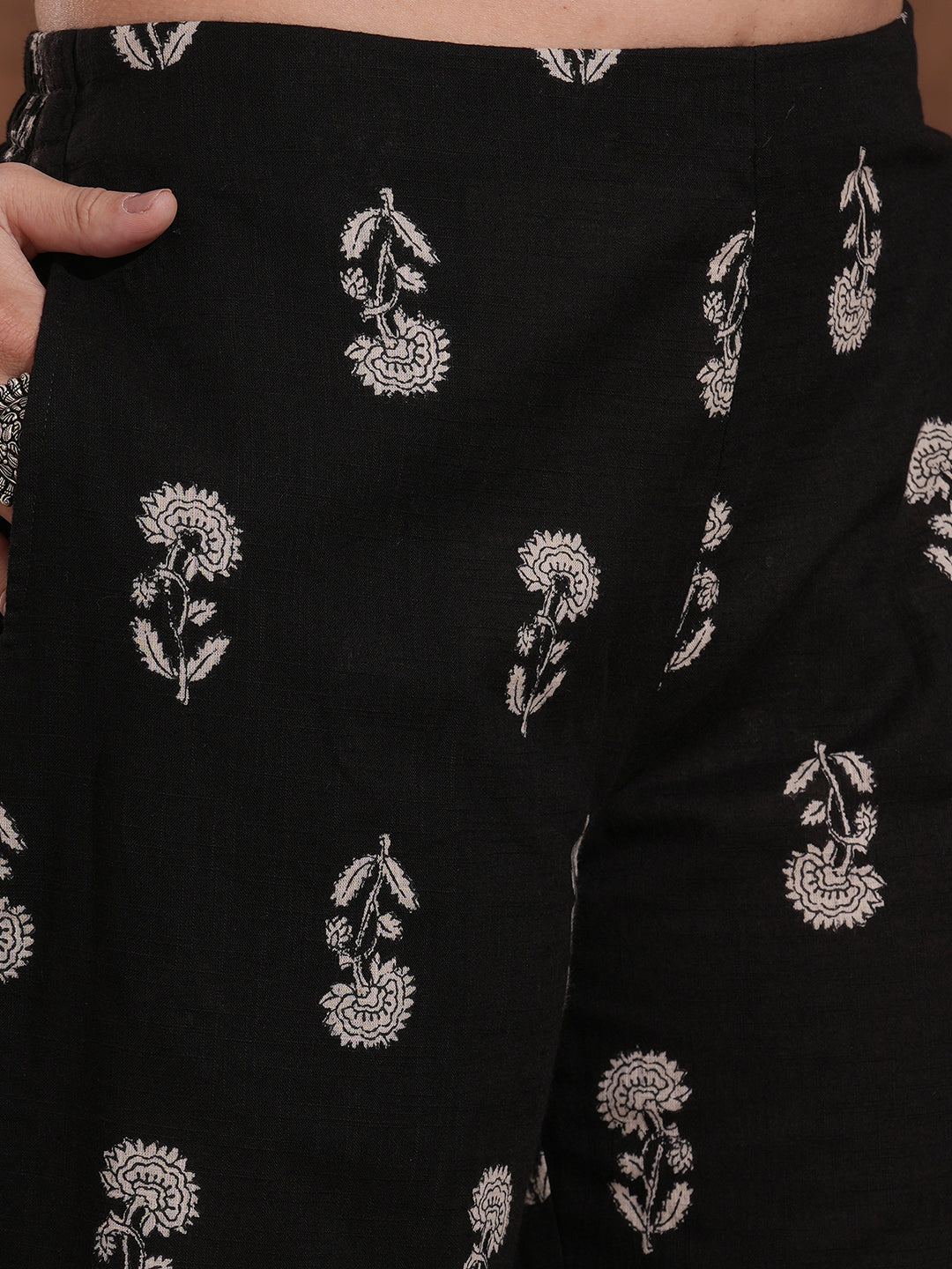 A-line kurta with block printed front and sleeves paired with printed palazzos.