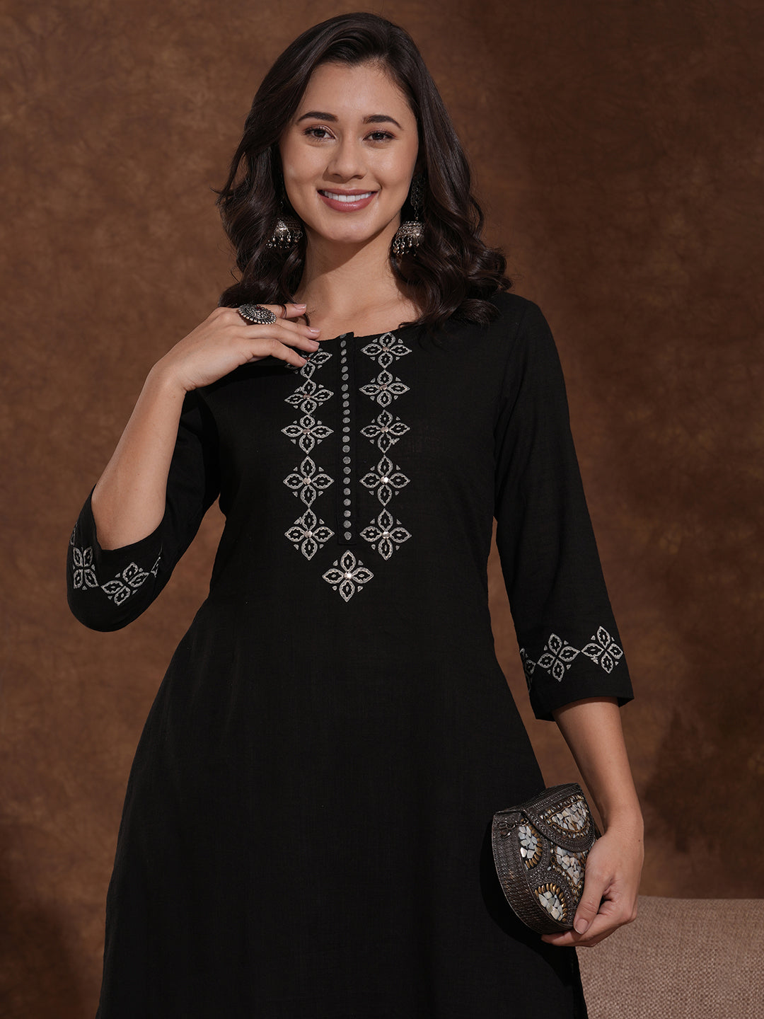 A-line kurta with block printed front and sleeves paired with printed palazzos.